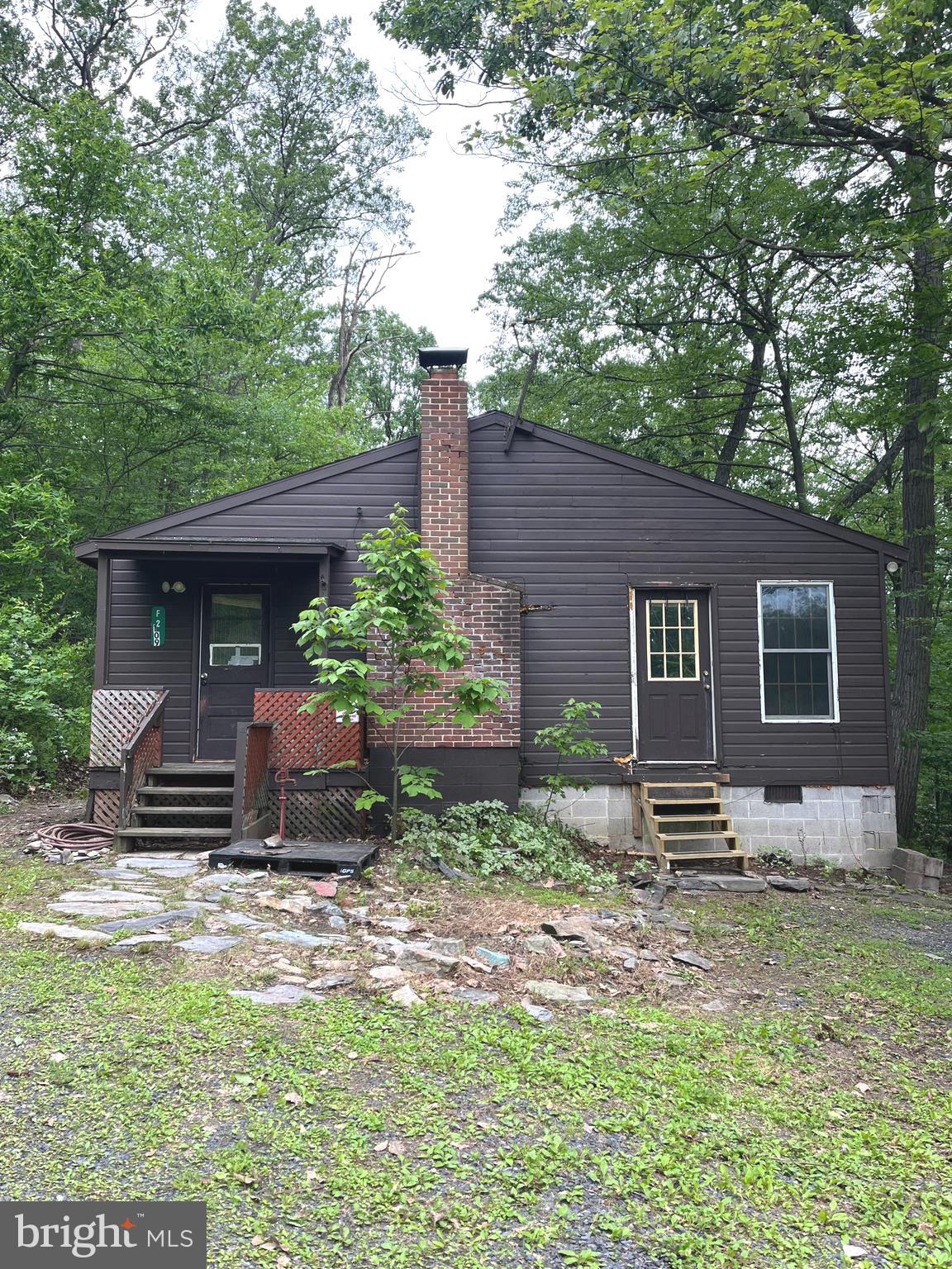 Rare Find, very private cabin on Bear Mountain. On over 2 acres at end of the road. Cabin is a blank slate for your dream retreat. Wood Burning fireplace, Open floor plan. 2 bedrooms, Wood floors, Family room could be used as bedroom . 4x4 or AWD a plus but not necessary except in winter. Being sold as is. Financing is probably limited to cash or conventional.