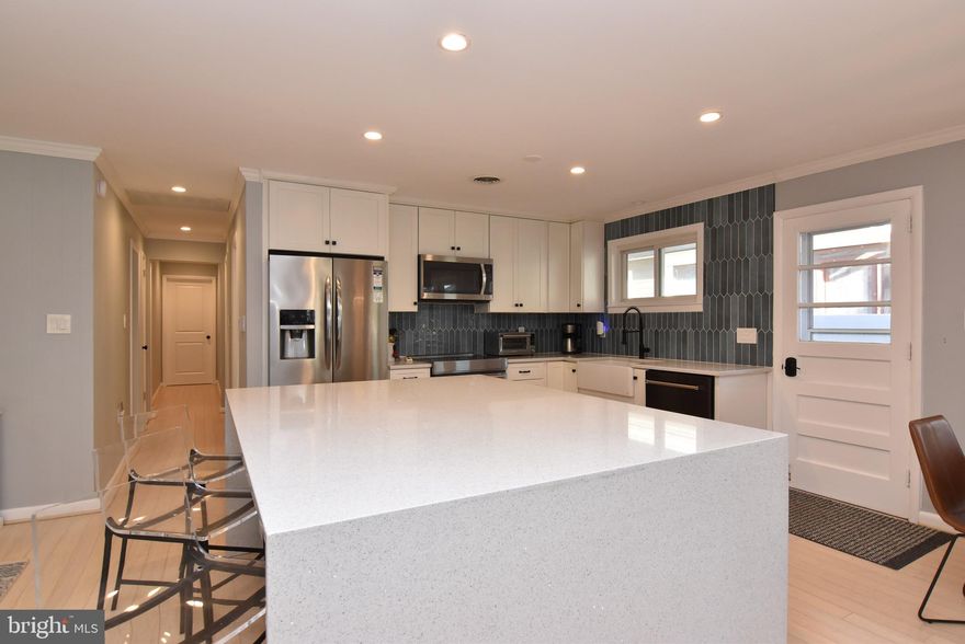 $25K Price Adjustment - Imagine owning your slice of Rehoboth Beach paradise! Welcome to 5 State Rd., an exquisite and beautifully remodeled five-bedroom ranch nestled in the absolute heart of this sought-after coastal town. This isn't just a home; it's a turnkey opportunity for an effortless, luxury beach lifestyle.

Step inside this inviting coastal retreat, from your traditional wraparound 15’ screened porch, where a sophisticated, updated interior flawlessly blends comfort and style. The layout is designed for modern living and entertaining. Enjoy the convenience of two modern, spa-like bathrooms, custom closets and the essential-for-the-beach luxury of an outdoor shower. The fully fenced backyard could be your private oasis, offering peace of mind for families and the perfect secure space for your beloved pets.

Location is everything, and this property delivers. You're not just near the coast—you're a few blocks from the Atlantic Ocean and the vibrant Rehoboth Beach boardwalk, putting world-class dining, boutique shopping, and endless summer fun right at your doorstep.

Beyond a serene getaway, this move-in-ready home presents an exceptional investment opportunity. With a projected summer rental income ranging from $75,000 to $100,000, this property is a proven performer in the lucrative vacation market. Don't miss your chance to secure this rare combination of prime location, stunning updates, and remarkable financial potential! Start living the Rehoboth dream today.