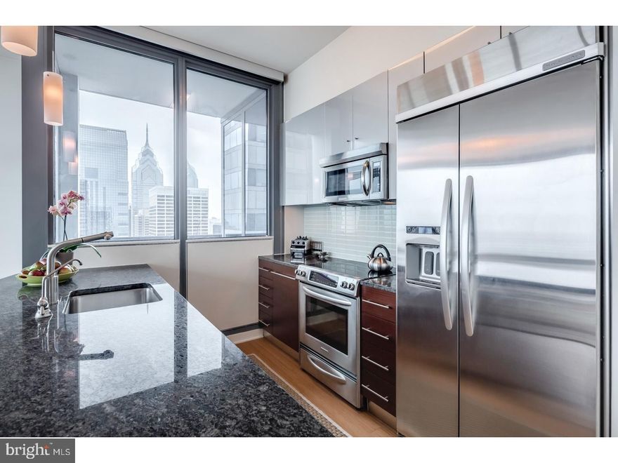 A Penthouse level spacious and luxurious condominium with amazing Northern City views including Philly landmarks like the Art Museum, Schuylkill River, Boathouse Row and the Franklin Institute. This 2bed/2bath residence is modern and luxurious boasting granite countertops, wood floors, stainless steel appliances, and floor to ceiling windows. Master bedroom has an ensuite bathroom with double sinks, separate bathtub and shower. The private balcony offers extended views of the city. Live like a VIP at The Murano with all it's amenities?24/7 concierge services, heated indoor lap pool, state-of-the-art fitness center, sun terrace, community room and much more. The price includes a reserved parking space in the attached covered garage, and a large storage locker.