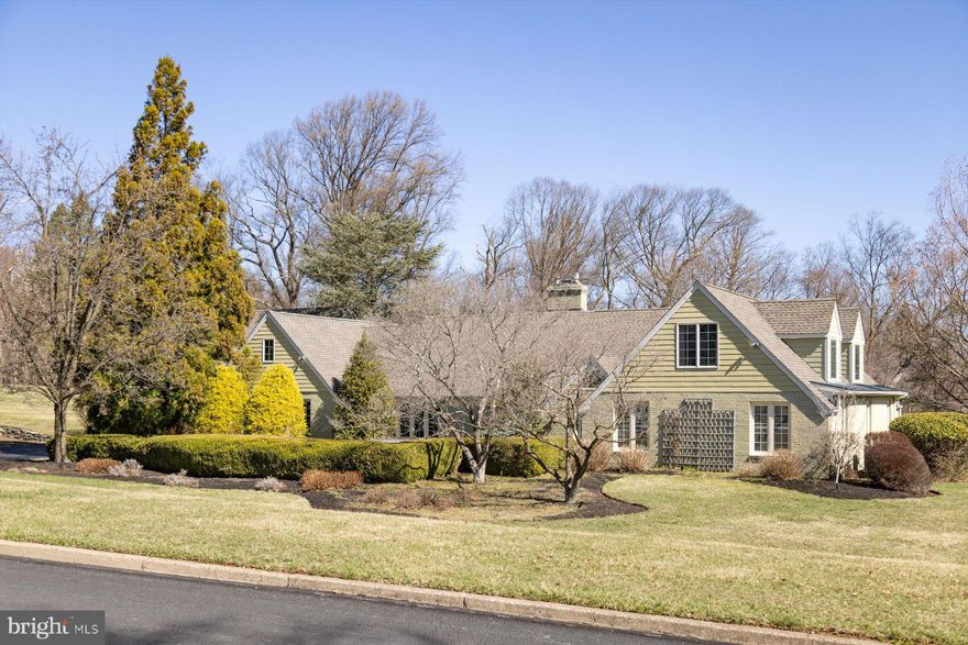 Red Fox Farms- Nestled on 2+ acres in this highly sought-after Solebury neighborhood, this beautifully maintained custom home offers exceptional craftmanship, modern convenience, and an adaptable floor plan to suit a variety of lifestyles.  Designed for flexibility, it features a first-floor main bedroom suite, 2 home offices, and private guest or au pair quarters, making it an ideal transitional or multi-generational home.  Unassuming from the exterior, this 4 Bedroom 4.1 bath residence provides primarily one-level living, with the exception of an en-suite 2nd floor bedroom  suite. The home’s low-maintenance exterior showcases primarily brick and Hardie board siding, a dimensional shingle roof, and  an entertainer’s dream with a salt-water pool, spa, expansive deck with pergola, and covered cabana overlooking the pool. Upon entry, the center foyer leads to multiple inviting spaces.  The formal living with fireplace, and dining room, each boast triple casement windows, while the custom-designed kitchen and gathering room serve as the core of the home.  The handsome renovated kitchen is a culinary dream, featuring  William Draper hand-crafted cabinetry, soapstone countertops, specialty glass tile backsplash, and top tier appliances, including a 5-burner Wolf range, Armoire style Subzero refrigerator, freezer drawers, pantry, Miele dishwasher, microwave, and a wine cooler. A marble pastry counter, stylish pendant lighting, and cork flooring complete the sophisticated space, which seamlessly flows into the adjacent gathering room with gas fireplace, and a wall of glass sliding doors to the outdoor pool and entertaining areas. There is also a step-down family room with vaulted ceiling and wood fireplace, an inviting retreat with built-in cabinetry, a wet bar, and direct access to the pool area  It is a great entertaining space and also serves as a gathering space near the in-law or spare bedroom area. A pair of offices, one presently a gym, are accessed  from the front foyer, with a powder room and  full bath just steps away- great for spillover company or additional bedroom space. The expansive first floor primary bedroom suite is a true sanctuary, highlighted by a cathedral ceiling, en-suite bath with jetted tub and shower, and a spacious walk-in closet.  French doors adorned with full length plantation shutters lead to a private deck overlooking the pool area.  Nearby, a turned staircase leads to a second-floor en-suite bedroom, with an adjoining walk-in attic  providing vast amounts of storage, or a space for potential expansion. There is an oversized attached 3-car garage with high ceilings, extra tall garage doors and an open span, ideal for car enthusiasts or installation of a car lift, if desired.  A large walk-up storage area above the garage is floored, yet another opportunity for a home gym, office, or creative space. Outdoors, the secluded rear yard is a haven of privacy, with lush landscaping and a protected treed backdrop.  The saltwater pool and spa, with limestone coping,  and expansive easy care composite deck adjoining the house create a luxurious escape, complete with a shaded pergola and covered cabana.  Additional highlights include zoned propane heating, central air, a whole-house generator, security system, and  the benefits of the top-rated NH/Solebury School District. With its unparalleled flexibility and exceptional amenities, this one-of-a-kind residence is ready to meet your needs, whatever they may be!