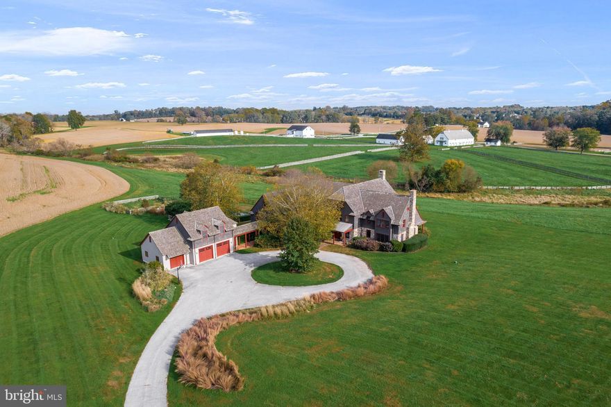 Absolute perfection! This John Milner- designed and Griffiths constructed sun-filled masterpiece is set on a gated 15.29 acre parcel with endless views, originally part of the historic 322- acre "Crebilly Farm". Featuring recent improvements including  new cedar shake roofs, new windows and other recent improvements in 2025, this custom designed and meticulously crafted residence was sited to maximize the breathtaking vistas, while offering easy access to all major commuting routs, renowned schools, endless recreational opportunities, shopping restaurants and Philadelphia International Airport. It was masterfully constructed using superior materials and timeless finishes with a wonderful, open, sun-filled floor plan and offers direct access to the adjacent 206 acres with future walking trails, under conservancy with Westtown Township and The Natural Lands Trust. Features include soaring ceiling heights with reclaimed beams and wide-plank red oak floors, gracious rooms with an easy interior flow and out to the exterior living and entertaining spaces with pool, meticulously crafted moldings, millwork, casements and built-ins, period hardware, custom lighting, fabulous gourmet kitchen with creamy custom cabinetry, soapstone countertops, expansive working eat-in island with multiple prep sinks, Professional Viking double range, and wall ovens, SubZero refrigerator/freezer, 2 dishwashers  open access to the bright breakfast room opening up to expansive terraces and pool area, jaw-dropping great room with 2-story stone fireplace, and incredible panoramic sight lines at every turn. The spacious secondary prep kitchen, mudroom with full bathroom to service the pool, back office and laundry area, offers endless storage, access to the rear staircase, oversized 3-car garage and spacious, private in-law suite over the garage. Walk up the main, bright custom-crafted staircase to the wide-open landing with access to the primary bedroom suite with endless private views, two walk-in closets and custom tiles marble bath, large loft overlooking the 2-story great room, 4 additional large sun-filled bedrooms, 2 additional custom baths, open lounge spaces adjacent to all bedroom suites and a full walk-up lower level that offers additional finished space. Absolute move-in condition. A one of a kind treasure!!