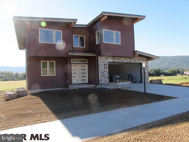 Spectacular contemporary home takes advantage of views from Tussey Mountain. Backs to open space for privacy. 3 full levels w/3 zone heat/cool, High ceilings and 2 gas fireplaces. Lower level finished w/kitchenette, living area, full bath and bedroom. Large deck off back & patio below. Builder pays attention to detail w/thoughtful design choices. Windows are over sized & take advantage of views. Master Suite has walk in closet, soaking tub, double vanities. Kitchen with island and granite. Walk in pantry.