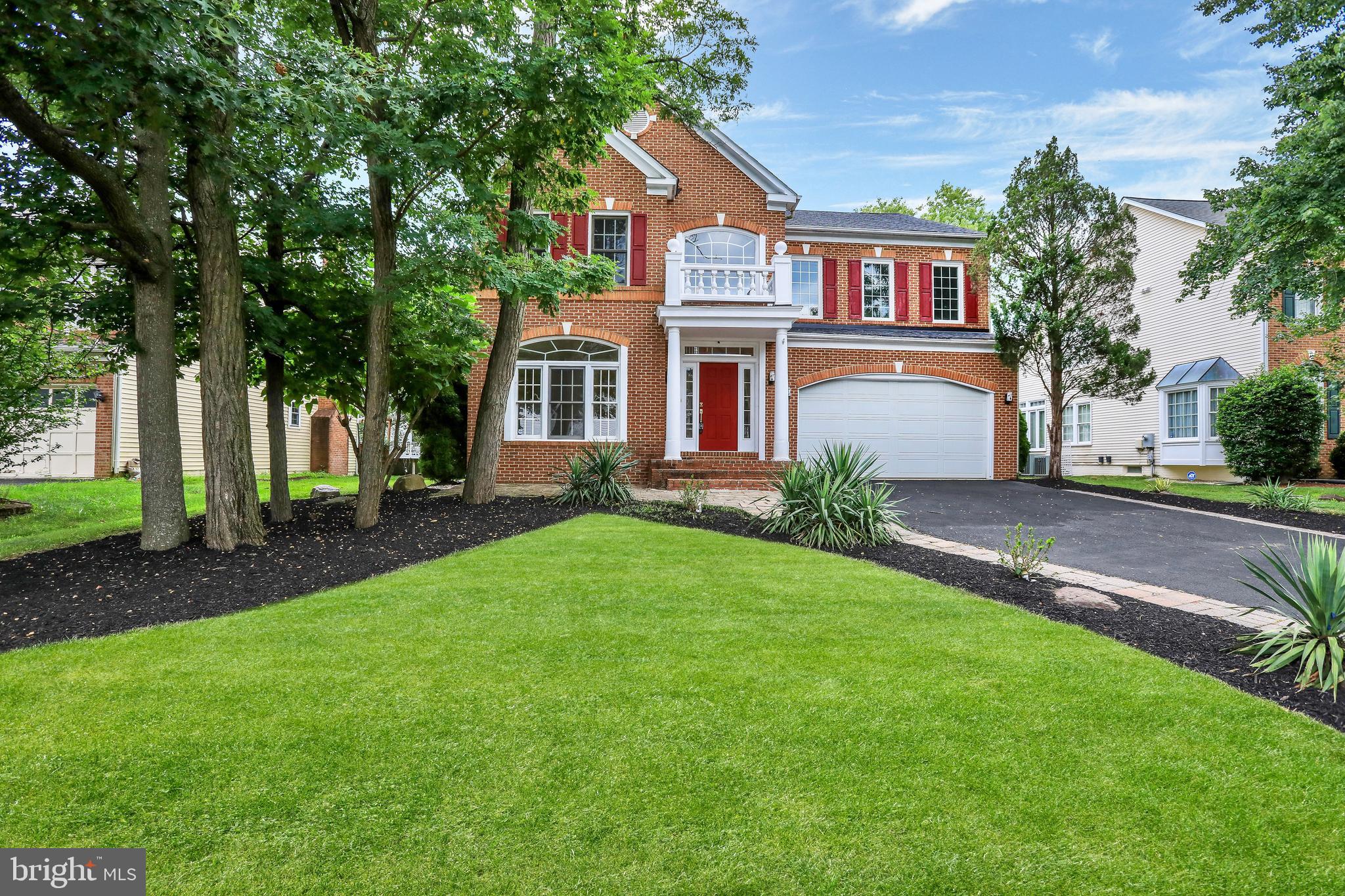 Welcome to 2054 Madrillon Road, a stately 4-bedroom, 4.5-bath Colonial nestled in the sought-after Madrillon Estates community of Vienna. Elegantly reimagined with high-end finishes and extensive upgrades throughout, this home offers over 5,000 square feet of refined living space—perfectly balancing everyday comfort with gracious entertaining. Ideally located just minutes from Tysons Galleria, Metro access, major commuter routes, and the vibrant core of Washington, D.C., this residence combines timeless style with exceptional convenience.
The grand two-story foyer sets the tone with soaring ceilings and abundant natural light, leading into a main level designed for both functionality and sophistication. A gourmet kitchen anchors the heart of the home with an expansive island, generous workspace, and premium appliances. The adjoining family room features a dramatic stone fireplace, while a formal dining room, beverage center, writing nook, and sun-filled addition with French doors provide space for both lively gatherings and quiet moments.
Step outside to a beautifully landscaped backyard retreat, complete with a built-in grilling area, wood-burning fireplace, and integrated seating—perfect for dining under the stars or hosting guests in comfort and privacy. A rebuilt front entry (2025), new windows and doors—including the garage door—and a 420-square-foot second-floor balcony addition add architectural charm and long-term value.
Upstairs, the luxurious primary suite offers a peaceful escape with a spacious sitting area, two walk-in closets, and a fully remodeled spa-style bath (2025). A second suite with private lounge offers flexible living options and can be reconfigured into two large bedrooms. An additional upstairs bath was recently added, and all bathrooms are outfitted with high-quality fixtures—most from Grohe or Hansgrohe—with lifetime warranties.
The fully finished walk-up lower level is ideal for multi-generational living or guest accommodations, featuring a complete in-law suite with a full kitchen, a large recreation area, a newly added full bathroom, new washer and dryer (2024), and updated plumbing throughout the remodeled space. A central dehumidifier system serves the lower and main levels for enhanced year-round comfort.
Additional features include dual-zone HVAC (both systems recently replaced, including a new unit in 2024), a 2023 water heater, new roof with 30-year warranty (2023), all-new flooring throughout, and sleek European storage cabinetry in the garage.
With every detail thoughtfully considered and beautifully executed, 2054 Madrillon Road is a rare opportunity to enjoy modern luxury and effortless elegance in one of Vienna’s most desirable neighborhoods.