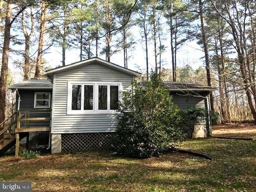 Cute rambler in a private 5 acre setting. Generous kitchen. Family room with a cozy fireplace. Freshly painted and gleaming hardwood floors throughout.  Screened porch over looking wooded backdrop.  Great basement to add additional finished space.  Paved driveway with ample parking and a turn around pad.