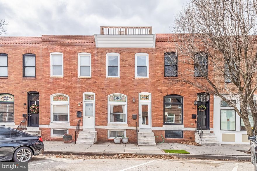 This is the one.  Unbelievable, newly updated rowhome steps away from Patterson Park with parking and lots of natural light!  Perfect blend of  stylish modern touches and restored historic features.   An addition was built on the home to enlarge the kitchen and ad a half bath on the main level.  Newly updated kitchen has pristine white cabinets, quartz counter tops and backsplash that goes all the way up , ceramic tile floor, and historic tin ceiling, gas stove, wine rack, and updated appliances.  This kitchen is equally stunning and functional and has a table space right outside the historic kitchen doors.   The first level is rounded out with a half bath and laundry closet boasting plenty of storage.  Also the restored original staircase has a ton of character leading up to the newly restored original hardwood flooring.   Upstairs there are two spacious bedrooms and a spa bathroom with tons of natural light, separate shower and tub, skylight, and a modern barn door.   The master bedroom has a huge closet and hardwood thru out.  The basement has been beautifully finished and includes custom built in shelves along with a new luxury full bathroom. It is perfect for a third bedroom, in law suite, extra living space - whatever you can think of. If the inside of this home wasn't enough, outside there are two decks, one on the second level and a rooftop deck that provides sweeping city views. There is a private parking pad in the rear of the house and angled parking out front. If you walk out your front door and take a peak to the left, you are greeted by Patterson Park.  Super cool marble steps at the front of the home.  Lots of updates including HVAC, carpet, roof with warranty, paint, updated windows, flooring, appliances, recessed lighting, exposed brick,  built in storage (ask about the storage in the beds), and more.  Awesome block to live one, wonderful location.  Bars, restaurants, parks, ice cream shops, sports leagues, ice skating, arenas, Canton waterfront,  Fells Point, Canton Square, and more all right outside your door.