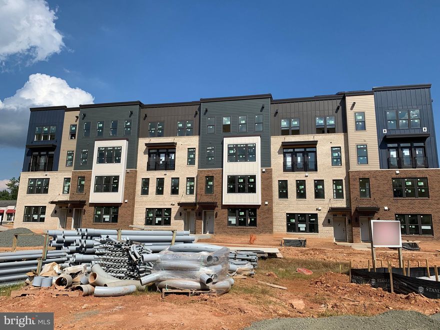 Stanley Martin's Ashton floorplan.  3BR/2.5BA with 1-car garage, lower level townhome condo. For comp purposes only.  Urban maintenance-free architecture in a strategic Reston. Open floor plans with gourmet kitchen with large Snow White Quartz countertops and tall Espresso Maple cabinets. Modern living with brand new finishes, 9-foot ceiling, and recessed lights. Spacious Master Bedroom Suite with 2 Walk-in-Closets, double vanities, and modern shower with clean glass doors. Balcony off 3rd bedroom. Very convenient access through underground passage to Tall Oaks Pool (part of Reston Association). Minutes to Wiehle-Reston Metro Station, W&OD Trail, Lake Anne, and Reston Town Center, shopping, restaurants, community events. Enjoy onsite parks, outdoor fitness stations, public art spaces, an outdoor amphitheater, and future retail!