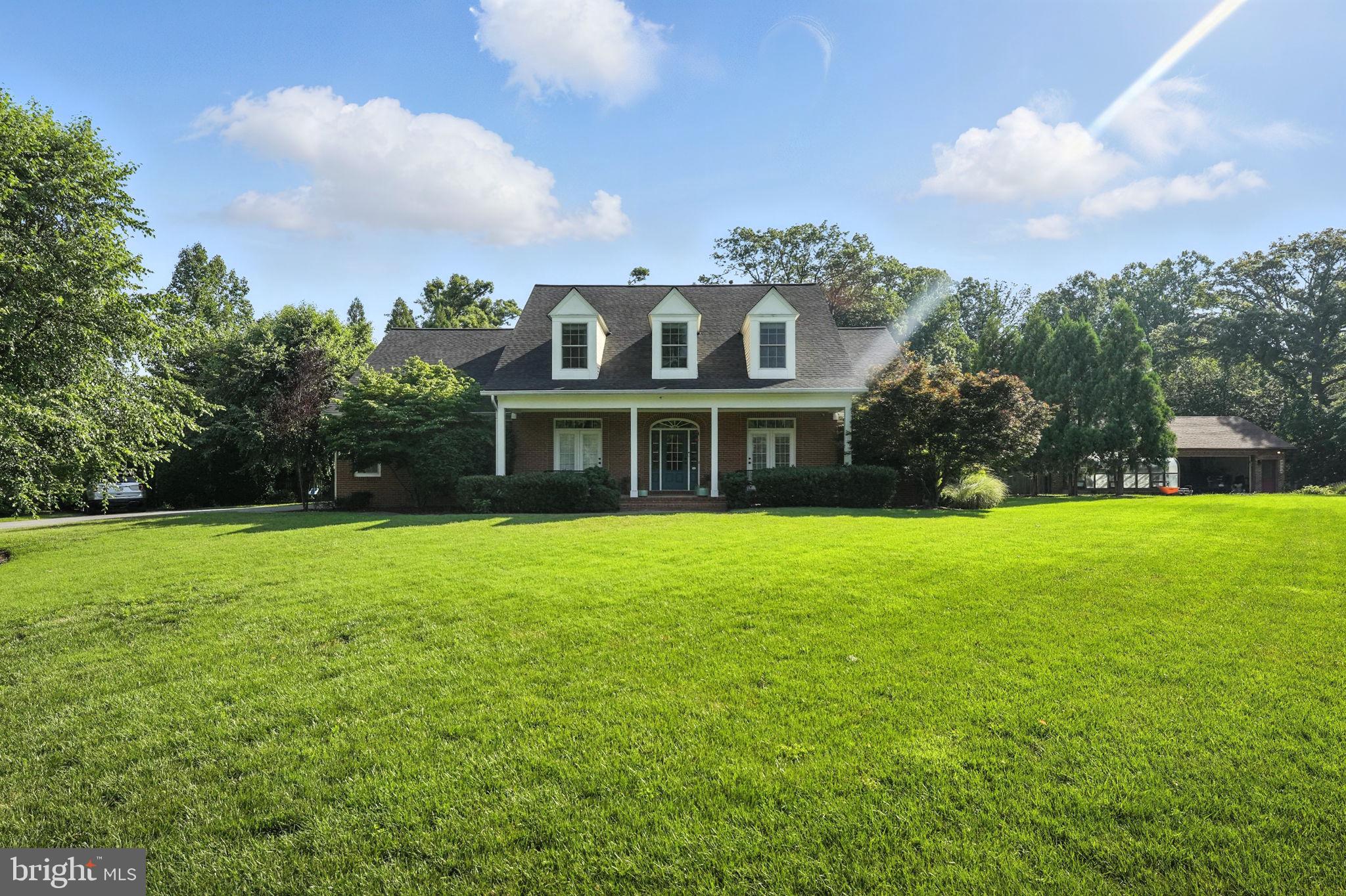 Nestled on a sprawling half-acre-plus lot, this breathtaking five-bedroom residence, built in 2010, exudes elegance and comfort from the moment you arrive. Its beautiful curb appeal is just a prelude to the meticulously designed interior, boasting gleaming hardwood floors and high-quality Andersen windows throughout.
The heart of the home is a chef's kitchen, a culinary dream featuring luxurious granite countertops, a spacious center island, and top-of-the-line stainless steel appliances, including a new stove and fridge. An inviting breakfast nook and formal dining room, offer excellent options for both casual family meals and sophisticated entertaining.
The main level offers unparalleled convenience and luxury. The Primary Suite is a true oasis, complete with a spa-like en-suite bathroom featuring dual vanities and an expansive walk-in closet. Also on this floor are a dedicated office, a grand living room with soaring cathedral ceilings and a cozy gas fireplace, a convenient half bath, and a well-appointed laundry room.
The lower level is an entertainer's paradise, boasting a massive recreation room and an outstanding media room, perfect for movie nights or sporting events. This basement also benefits from high ceilings and recessed lighting, and includes an additional office, a comfortable bedroom, and a full bathroom, along with an abundance of storage space to keep everything organized.
Upstairs, three generously sized bedrooms await, each with large closets. A practical Jack-and-Jill bathroom with a double vanity serves two of these rooms, the third with its own en-suite full bath. Finally, upstairs, an additional walk-in closet for extra storage.
Step outside to discover a picturesque yard, beautifully landscaped and featuring a charming flagstone patio, ideal for outdoor gatherings and relaxation. The oversized two-plus car garage provides ample space for vehicles and storage galore. Adding to the convenience, this exceptional home is just two miles from the Metro, offering easy access to urban amenities. HVAC 2009, Water Heater 2022, Windows 2023, Roof 2025.
