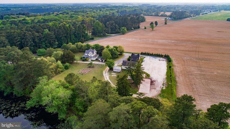 Gorgeous 29 acre waterfront farm with 1200 feet of frontage on Parker Pond. Sold AS IS this REO property is in need of restoration on the BARNS but the HOME IS GOOD AND has 3 floors of hardwood floors, high ceilings, a brick basement, a newer furnace and a newer roof. The kitchen needs updating but the bones of the home are excellent! The wrap around porch could be stunning again and the land is peaceful and inviting for a myriad of activities, gardening, horses. The 4 stable barn appears to be capable of restoration. Convenient to Route 50, Route 13, Ocean City, 7 minutes to downtown Salisbury, Salisbury Airport, this east side farmette is a diamond in the rough! And YES the ''potato shed'' at the corner next to the pond is on the property!! See attached plat.