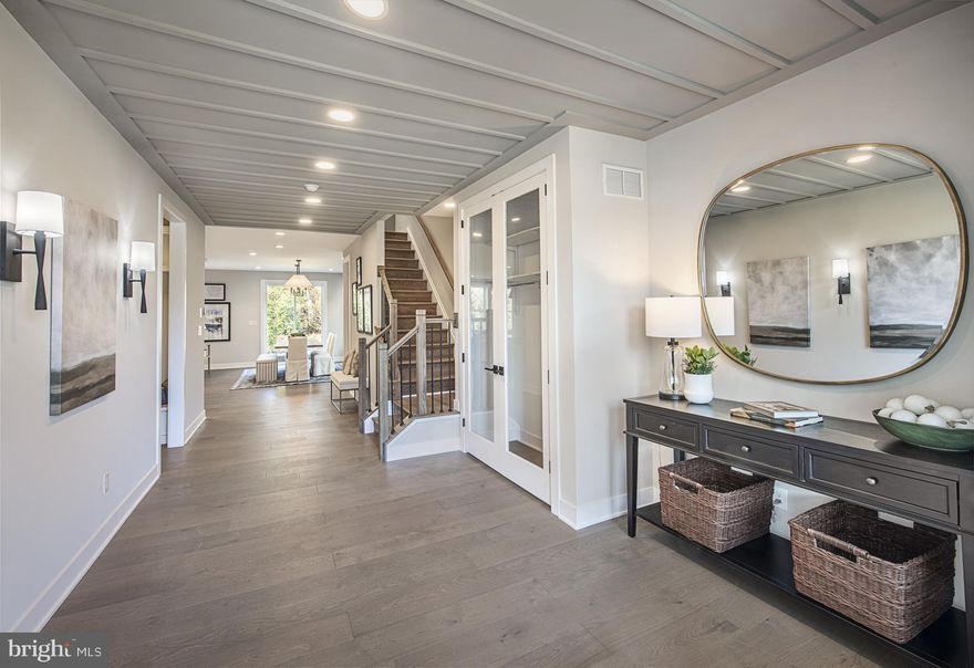 The Kelvin Elite's spacious foyer offers views of the expansive great room and casual dining area with rear yard access. Enhancing the well-appointed kitchen is a large center island with breakfast bar, plenty of counter and cabinet space, and an ample walk-in pantry. The serene primary bedroom suite is highlighted by a generous walk-in closet and a splendid primary bath with a dual-sink vanity, a luxe shower with seat, linen storage, and a private water closet. Two of the secondary bedrooms feature ample closets and share a hall bath with a separate dual-sink vanity area, and one features a walk-in closet and a private bath. Additional highlights include easily accessible second-floor laundry, a powder room, an everyday entry, and plenty of extra storage.