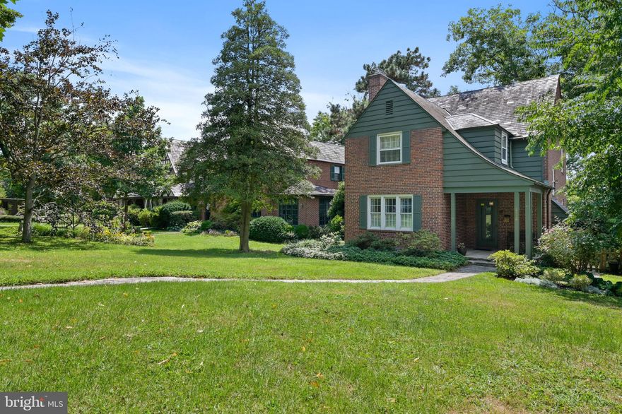 This sun-drenched historic Tudor offers hardwood floors, original architectural features, elegant lines, and solid craftsmanship. Walk through the original front door to a welcoming entry foyer that opens up to a spacious living room with built-in bookcases, multiple windows for ambient light, and a wood-burning fireplace with original mantle. There is a traditional formal dining room with a built-in corner cabinet and French doors leading to a covered back porch overlooking the fenced back yard. A renovated eat-in kitchen features stainless steel appliances. The second level contains three bedrooms and two full bathrooms, one in the hallway and one en-suite. A large third floor bonus room with a walk-in closet could be a bedroom, office, or studio. The 21x11 lower level family room is generously proportioned, with an attached laundry area and half bath. Mature trees and flowering perennials make this home a gardener's dream. Close to downtown, JHU, JHH, MSU, and the newly redeveloped Northwood Commons shopping center. Come and see it today!