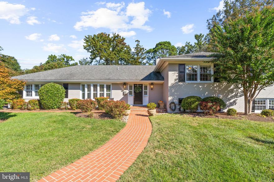 Welcome to 1214 Belle Vista Drive, a beautiful 4 bedroom, 3 bathroom  home nestled on a generous .35-acre lot in Alexandria’s Villamay. As you approach, you’ll be immediately captivated by the expansive front yard and welcoming façade. The house is thoughtfully sited, offering a lovely flat backyard with a terrace ideal for outdoor gatherings, a morning cup of coffee, al fresco dining, and enjoying the serene surroundings. This home presents over 3,294 finished square feet of living space spread across three levels. The formal living room and dining room are both inviting and spacious perfect for formal gatherings, while the lower level features a large recreation room providing an excellent space for game night or movie nights! The gourmet kitchen is a chef’s dream with white cabinetry, stainless steel appliances, granite counters, under cabinet lighting and an open layout that seamlessly connects to the breakfast room – from here, step out onto the back terrace, creating the perfect setting for outdoor dining or relaxation. The upper level is home to three bedrooms and two full baths including the primary bedroom suite – the ideal retreat after a long day at work with spa-like ensuite bath with dual vanity and glass-enclosed shower and large walk-in closet. A fourth bedroom and full bath in the lower level is the perfect space for guests! Other highlights of the home include hardwood floors, beautiful moldings, plantation shutters, recessed lighting, two gas fireplaces that create a cozy ambiance just in time for the fall weather, a mudroom off the garage and plenty of attic storage! A 2-car garage with long driveway and motor court offers ample parking for visitors. Just around the corner from the local park, conveniently located 1.3 miles from Hollin Hill shopping center and 1.9 miles from Belle View shopping center. A mere 4 miles to the historic charm of Old Town, Alexandria ideal for a date night, and just a short drive to National Harbor (5.9 miles), Reagan National Airport (7.5 miles), Amazon’s HQ2 (7.9 miles), the Pentagon (9 miles), and downtown Washington DC (11 miles).