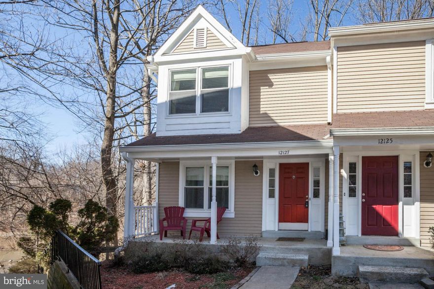 RARELY AVAILABLE VERY SPECIAL BACKS TO LAKE AND TRAIL front porch END UNIT with SPECTACULAR VIEWS! On the loveliest row in the community. MOVE IN READY Fully updated, light filled, fireplace LR, all new windows, gorgeous, private deck, master suite, built ins, 3 bdrms up, freshly painted neutral, finished lower level with walk out and huge workroom/storage