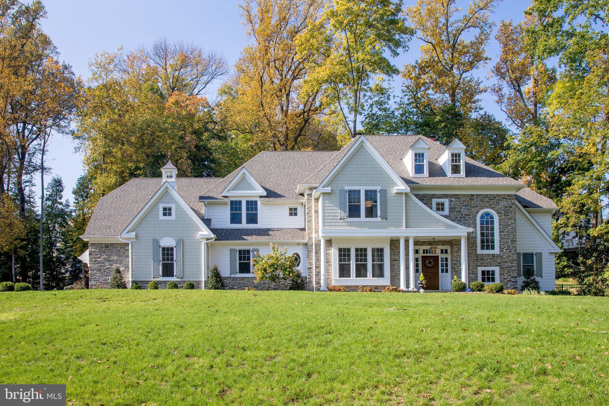Nestled near the end of a private lane of only 7 homes, in a premier neighborhood with walk-ability to the charming town of Wayne, sits this 5 bedroom, 4 & 2 half bath residence. This newer construction gem, hand-crafted by renowned builder Chip Vaughan, is positioned on 2.27 acres and offers the quality & high-end features you would expect in a custom Vaughan creation. Every detail has been considered, from the gracious floor plan and well-proportioned rooms to the refined finishes, classic details and modern design. Outside, beauty and serenity surround you. Lush landscaped grounds with estate fencing afford sprawling lawn for family fun, and tall trees & shrubs for peace & privacy. There is even an acre+ secured by an invisible dog fence. Best of all, you will love entertaining friends & family in the rear yard oasis featuring an in-ground pool with auto-retractable cover and flagstone patio you can enjoy well into the fall - all overlooking picturesque views. Interiors are as warm and welcoming, introduced by an airy double-height foyer. Gorgeous hardwoods, exquisite millwork & moldings, coffered ceilings & built-ins lend elegance throughout, while large windows bring in nature & generous light. The layout is ideal for family living, with plenty of room to be together or apart. Lounge with guests or sip wine & read a book in the lovely living room with fireplace. The dining room is perfect for Sunday dinners, wine tasting parties or any occasion, with a convenient butlers pantry nearby. With its custom bookcases on 2 exposures and abundant natural lighting, the home office provides a beautiful background for video conferencing. For those who love to cook & entertain, the open-concept chef?s kitchen, breakfast room & family room allows the cook to gather with family and friends. This dream kitchen is appointed with a large marble topped center island, ceiling-high cabinets, 2 dishwashers flanking the sink, a 48" dual fuel range and a hidden walk-in pantry with 2nd refrigerator/freezer, sink, with faucet and Insta-hot & cold. Enjoy casual meals in the sunny breakfast room, relax around the fire in the stunning family room, and open the doors for seamless indoor-outdoor gatherings. Sophisticated & calming, the primary bedroom is an inviting sanctuary. A sitting area opens through double doors into the suite. A domed ceiling, expansive dressing closet with window & island, additional walk-in closet, and high-end white marble bath with a soaking tub & spa shower heighten the luxury. Each spacious secondary en-suite bedroom also has its own walk-in closet. A custom-built 1750+ bottle wine cellar will accommodate your favorite vintages. Other highlights are abundant closets & storage, an unfinished lower level awaiting your custom finishes, oversized 3-car garage with high ceilings, 4-zone HVAC & 2 furnaces, water softener and filtration system, in a coveted Wayne location that is easy to forget how conveniently close you are to everything, including award winning Radnor schools. Source of acreage is from Final Subdivision Plan submitted and accepted by Radnor Township in 1988.