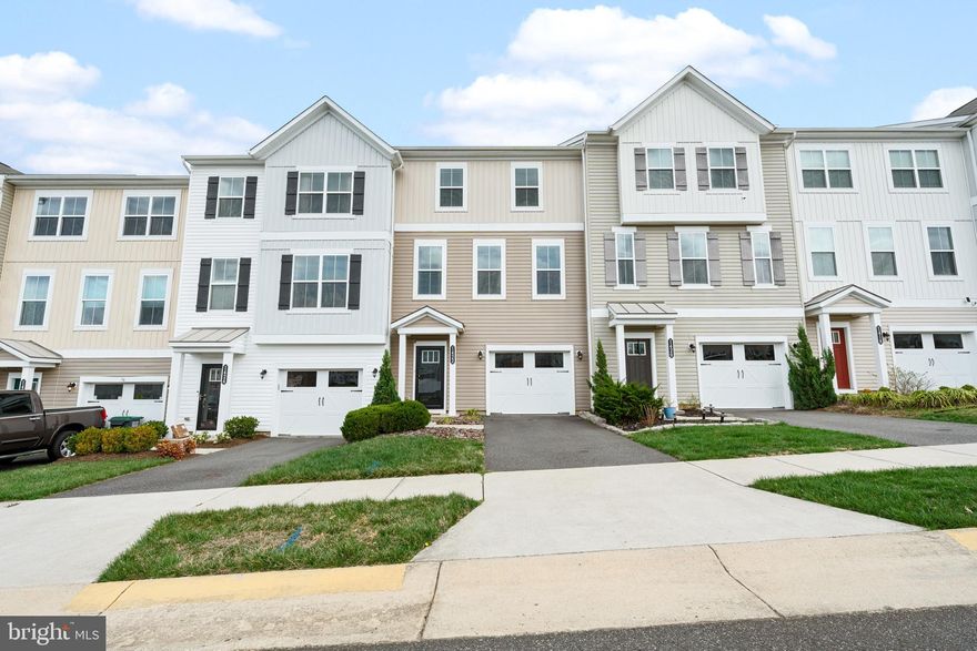 Welcome to this beautifully maintained 3-bedroom townhome in the desirable Summerfield community! With an open and inviting floor plan, modern finishes, and a fully finished basement that can serve as a 4th bedroom or additional living space, this home is designed for comfort and versatility.

Step inside to find a bright foyer with convenient access to the one-car garage and a lower-level flex space—perfect as a guest suite, home office, or entertainment room with a full bathroom. The main level boasts a spacious, open-concept layout featuring wide-plank flooring, a sunlit living room, and a stylish kitchen with granite countertops, stainless steel appliances, a large island, and ample cabinetry. A dedicated dining area and powder room complete this level, making it ideal for both everyday living and entertaining.

Upstairs, the primary suite offers a serene retreat with a walk-in closet and a private en-suite bath. Two additional bedrooms, a full hall bath, and a laundry area provide convenience and functionality. Outside, enjoy a backyard with space for relaxation or play, plus easy access to community walking trails and green spaces.

With fresh paint, thoughtful design, and a prime location close to shopping, dining, and major commuter routes, this home is ready to welcome its next owner. Schedule your showing today!