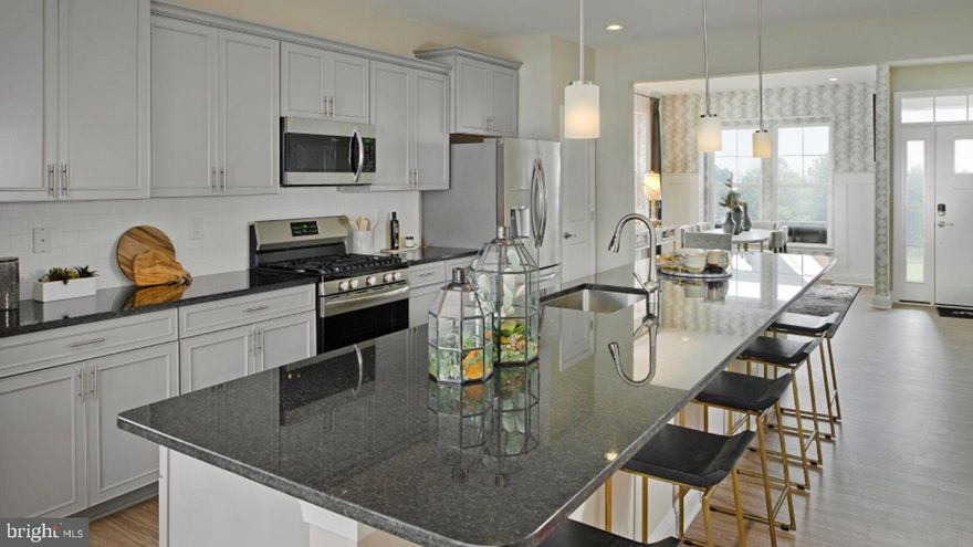 Beechfield Manors is the newest active adult 55 & Better Community in Prince George's County.  A planned community with a clubhouse, fitness center, firepit, and swimming pool. Located off Enterprise Road, near shopping, dining, and recreation, including several golf courses.
 
TO BE BUILT - This 3-bedroom home, with loft, 2 ½ baths, 1 car garage has a low maintenance layout with a first-floor owner’s suite, laundry area, separate dining room, large open kitchen with Island, and great room with gas fireplace & covered patio access.  The serene owner’s suite features a full-sized bathroom and a location separate from all the upstairs bedrooms to provide maximum privacy. On the second floor is a comfortable loft for additional shared living space, two secondary bedrooms, full bathroom, and a versatile unfinished storage space.
 
Prices and features may vary and are subject to change. Photos are for illustrative purposes only and not of actual home. 
 
Home estimated to be ready May 2023
 
Seller closing assistance is available with in-house lender Lennar Mortgage