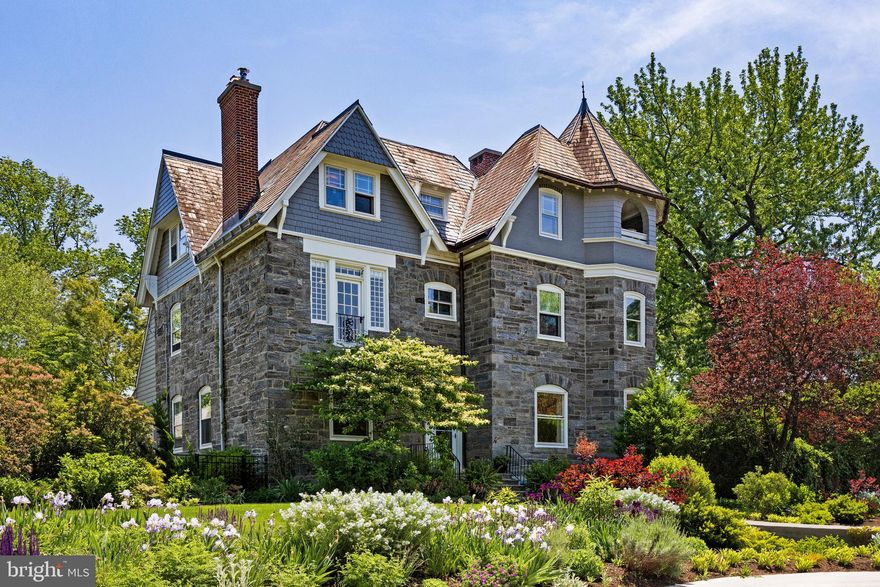 Welcome to 246 W Evergreen Avenue, where timeless elegance meets modern luxury in the heart of Chestnut Hill.  Set on a beautifully landscaped one-third acre lot, this extraordinary 6-bedroom, 3.5-bathroom residence offers the perfect blend of classic architecture and contemporary upgrades. With super high ceilings throughout, expansive windows, and a distinctive curved wall that captures natural light through sunset, every room feels open, airy, and luminous.  Originally commissioned in 1886 by Henry Houston and designed by the renowned Hewitt Brothers, this stately home was one of the first built in West Chestnut Hill and is recognized as “significant” within the Chestnut Hill Historic District Inventory. Constructed of locally sourced Wissahickon schist—a hallmark of Philadelphia architecture—it stands as a testament to enduring craftsmanship and historic charm.  Inside, you'll find a home that has been thoughtfully and extensively updated to meet the highest standards of comfort and style.  Highlights include: designer kitchen renovation with custom cabinetry, marble and quartz countertops, GE Café Select appliances, and a large island perfect for gathering, complete electrical rewire and expanded panel to support today’s modern living, plus an EV charging outlet, two-zone central air, including a high-velocity system for maximum comfort on every floor, rebuilt chimneys, refinished original hardwood floors, custom French doors and casement windows to bring the outdoors in, a new rear deck and resurfaced patio ideal for al fresco dining and entertaining, a glass-enclosed mudroom, repaved driveway, detached historic carriage garage offering versatile storage or workspace, fully refreshed interior and exterior paint, along with designer lighting throughout for a polished, cohesive feel.  The home's intelligent layout offers generous space across three levels, with bright, oversized rooms that feel as functional as they are beautiful. The upper floors provide flexibility for bedrooms, offices, or creative studios, all bathed in natural light and accented by those soaring ceilings rarely found in today’s homes.  Outdoors, enjoy lush, established gardens with mature plantings, privacy-enhancing arborvitae, and a colorful front bed that ensures year-round curb appeal.  This is more than just a home—it’s a spacious, sun-drenched sanctuary with a storied past and a bright, modern future.  A rare opportunity to own a move-in ready masterpiece in one of Philadelphia’s most desirable neighborhoods.