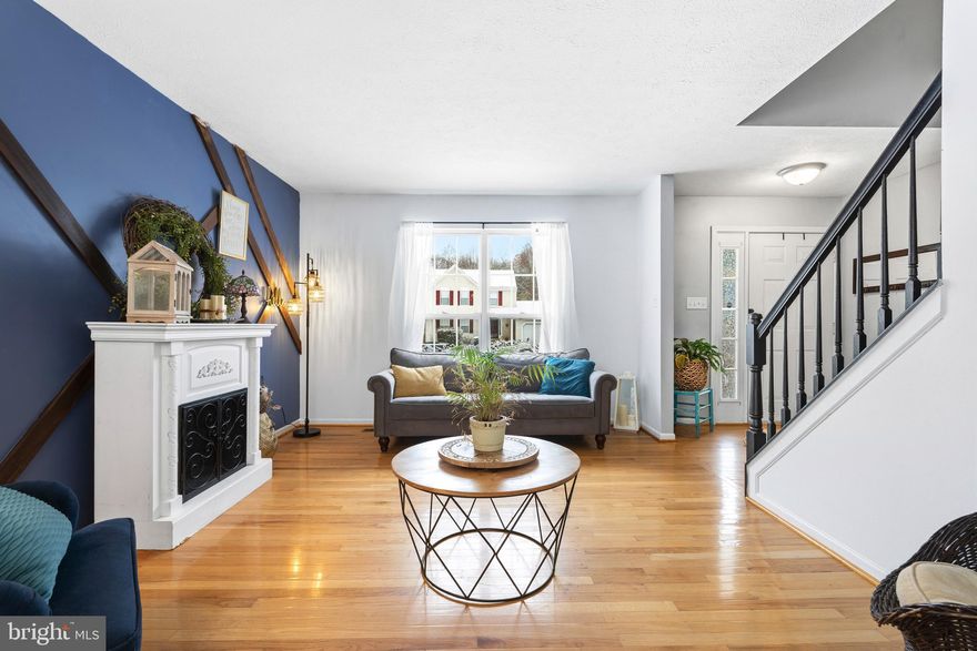 Welcome to this beautifully maintained colonial, ideally situated on a quiet, tree-lined lot offering privacy, space, and exceptional indoor-outdoor living. An attached two-car garage, classic curb appeal, and mature surroundings set the tone for a home designed for comfort and versatility.

The main level features gleaming hardwood floors and a bright, open layout ideal for both everyday living and entertaining. The spacious living room is anchored by a cozy fireplace and custom accent wall, with oversized windows and French doors that open directly to the rear deck, creating seamless indoor-outdoor flow.

The updated kitchen serves as the heart of the home, featuring white cabinetry, granite countertops, stainless steel appliances, and a large center island with seating. A sun-filled breakfast bar adds casual dining space, while the open layout connects effortlessly to the dining and living areas. A main-level powder room adds convenience for guests.

Upstairs, the home offers well-proportioned secondary bedrooms with neutral finishes and ample natural light. A full hall bath serves the secondary bedrooms, while the primary suite provides a true retreat with vaulted ceilings, hardwood flooring, a walk-in closet, and a spa-inspired en-suite bath with double vanity, soaking tub, and separate glass-enclosed shower.

The finished lower level significantly expands the home’s usable living space and offers incredible flexibility. It includes a large recreation and media area, a custom bar with seating ideal for entertaining, a full bathroom, a separate finished room suitable for a guest space, office, studio, or hobby room, and a dedicated laundry and utility area with additional storage.

Outside, the home truly shines. The expansive multi-level deck system offers multiple spaces for entertaining, dining, and relaxing, including a screened-in porch overlooking the private, wooded backyard, perfect for enjoying the outdoors in comfort across multiple seasons. The fenced yard includes an above-ground pool for seasonal enjoyment, and the home’s elevated setting provides scenic views and a sense of privacy, as highlighted by the aerial views.

With three finished levels, flexible living spaces, abundant natural light, and exceptional outdoor features, this home offers a rare combination of space, privacy, and lifestyle value. Thoughtfully maintained and move-in ready, it delivers comfort both inside and out.