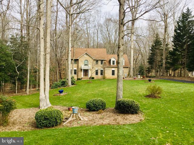 Absolutely gorgeous custom colonial situated on a 2.35 Acre lot in a culdesac surround by other custom brick homes in the upscale community of Pheasant Farms off of Turkey Hill Rd in La Plata. Convenient to commuter routes, dining & shopping. This sprawling colonial offers many areas for entertaining, a personal study/library, formal living & dining, spacious sun room overlooking the "park like" back yard, the lower level opens to sunshine & windows with a large gathering area, fireplace, bedroom & full bath, plus additional open space. The 2nd level offers a spacious master w/ sitting room, large super bath with corner tub & walk in shower, hardwood flooring and 3 spacious guest room. This home is a 10! Do not pull in driveway, must be accompanied w/ your Realtor, park in culdesac *Real Sand & Finish hardwood flooring thru out.