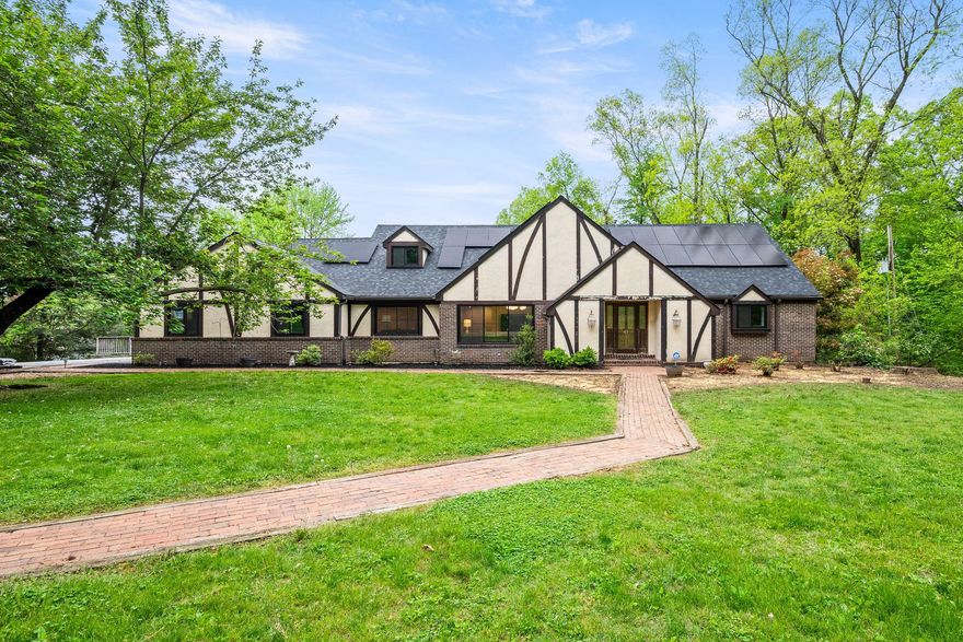 Your new home awaits at 41 Devon Drive, in the highly sought-after community of Glen Oley Farms. This exceptional Tudor, nestled on a beautifully landscaped 1.33-acre lot, is ready for your finishing touches.  This 4-bedroom, 3-bath home offers a perfect blend of timeless architecture, refined finishes, and no lack of attention to detail.  From the moment you arrive, you will be able to see the vision. The vaulted foyer lets in a ton of natural light and will invite you right in.  Off of the foyer, you’ll find a large living room with coffered ceilings, attached home office with a feature wall, rich architectural details, and high-end finishes.  Another oversized room is the center of the home with a brick fireplace and an oversized window overlooking the mature landscaping. This could be your dining room or additional family room.  The gourmet kitchen is  well loved and perfect for everyday living and entertaining.  Off of the kitchen is a powder room (needing finishing) and the laundry room. Also on the first floor, on it's own wing of the home,  is the primary suite featuring a walk in closet, sitting room with fireplace, and a full bathroom.  All just waiting for you to bring the vision to life. Upstairs there are 3 bedrooms and 2 full bathrooms.  One bedroom has it's own private bathroom (will be finished prior to closing) and the other two bedrooms share a Jack and Jill style bathroom.  All generously sized, offering flexibility for family or guests.  The craftsmanship here is top notch-shiplap, board and batten, built in desks, California closets, accent walls, and ceilings.  All that's left to do up here is unpack your bags. The 1700 square foot walk-out basement could add additional living space or make for an impressive in-law quarter. Down here there is a bedroom, full bathroom, kitchen, and two living spaces framed/plumbed/wired out and ready for finishing.  Step outside to enjoy the expansive deck, firepit,  privacy, and tranquility. New here is a recent roof replacement, solar panels, Anderson windows, and tons of interior upgrades. 41 Devon Drive is truly a one-of-a-kind property and a fantastic opportunity to add equity as you create your dream home. This gives you the opportunity to let your vision come to life with the potential of 5-6 bedrooms, 4 bathrooms, 5700 square feet and a value of $750,000.  You have to see it for yourself!