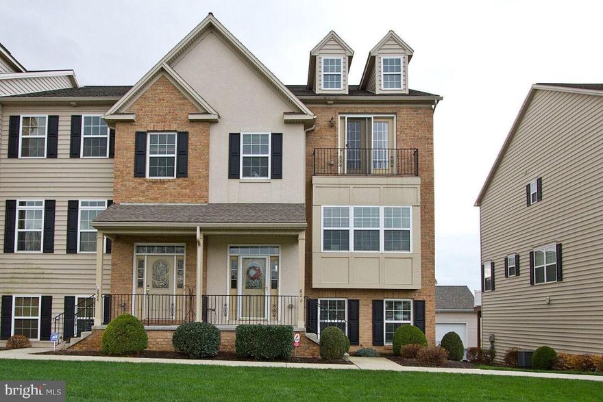 Location? Yep, it's got that too!  Elevator to access all 3 floors of this spacious end unit town home with over 3000 finished square feet. Hardwood floors through out the first floor including master bedroom. Kitchen with ceramic tile backsplash, granite countertops, walk-in pantry, island all open to a cozy living room w/gas fireplace. Slider doors to covered deck off of living room. Open first floor with arched door ways, custom trim/crown
