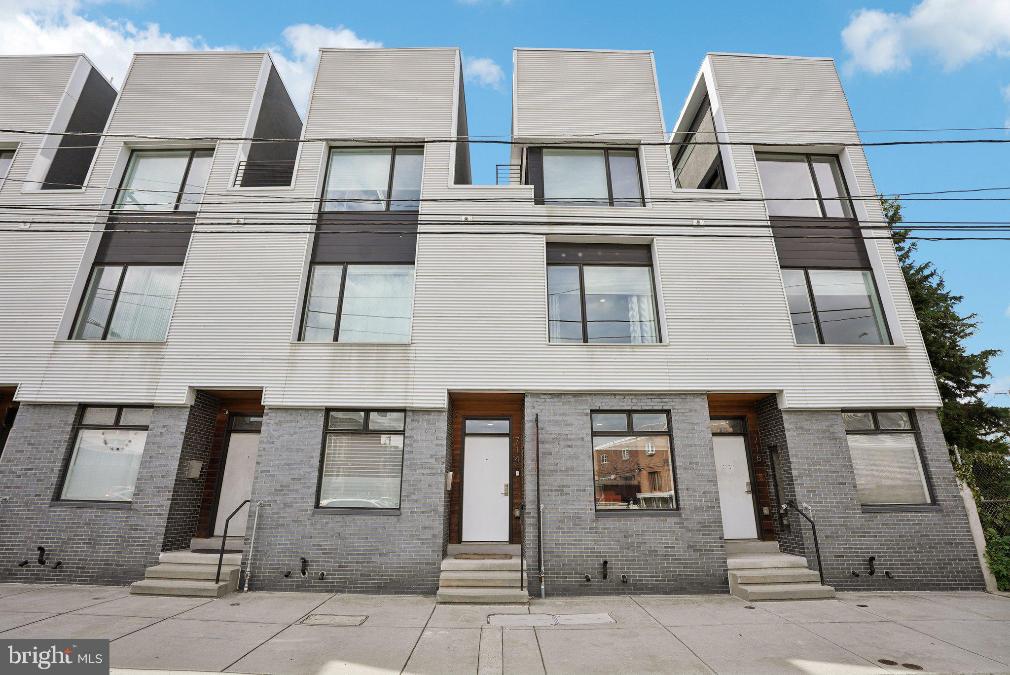 Well-maintained 3 bedroom, 3 bath rowhome in the desirable Northern Liberties/East Poplar area of Philadelphia offering 2,560 sq ft of sleek living space, parking, and one year left on the tax abatement! Just a few years old, this home features a spacious layout with top-notch construction and modern amenities. The custom kitchen is a chef’s dream with stainless steel appliances, granite counters, tiled backsplash, and abundant wood cabinetry. Bathrooms showcase quality finishes with EZ-close vanities, glass shower doors, and meticulous tile work. Throughout the home you’ll find new hardwood floors, tall ceilings, closets with custom shelving, and a convenient washer and dryer. A gorgeous modern façade with large sunny windows, plus a rooftop deck with stunning views, add to the appeal. Perfectly located near all the best spots in Northern Liberties including Liberties Walk, the Piazza, Liberty Lands Park, Orianna Hill Dog Park, Honey’s, Yards Brewery, Silk City Diner, Target, Amazon Fresh, and easy access to the Market-Frankford line. *Mortgage savings may be available for buyers of this listing.*