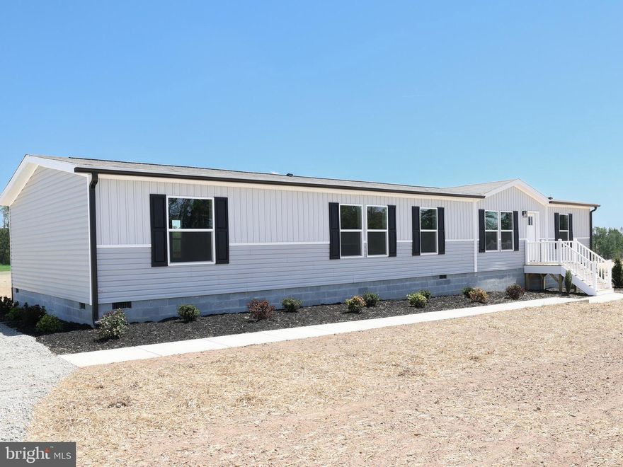 COMPLETE! Brand-new 3-bedroom, 3-bath home situated on 1.81 acres, conveniently located just minutes from Mineral and a short drive to Lake Anna. The interior offers 2,001 square feet of living space with an open floor plan, two living areas, flex room and office space. 10x12 rear deck off the sliding glass door. Features include Shaw Lino flooring, a coffee bar area, decorative accent wall, large island and recessed lighting. The kitchen is well appointed with Duracraft cabinetry, stainless steel appliances, pot-and-pan drawers, a decorative range hood, and a utility room located just off the kitchen. The primary suite includes a double vanity and a spacious tub/shower combination. Exterior highlights include a farmhouse-style design, extensive landscaping, a large rear deck, and concrete walkways. Home is located within the Firefly internet service area!