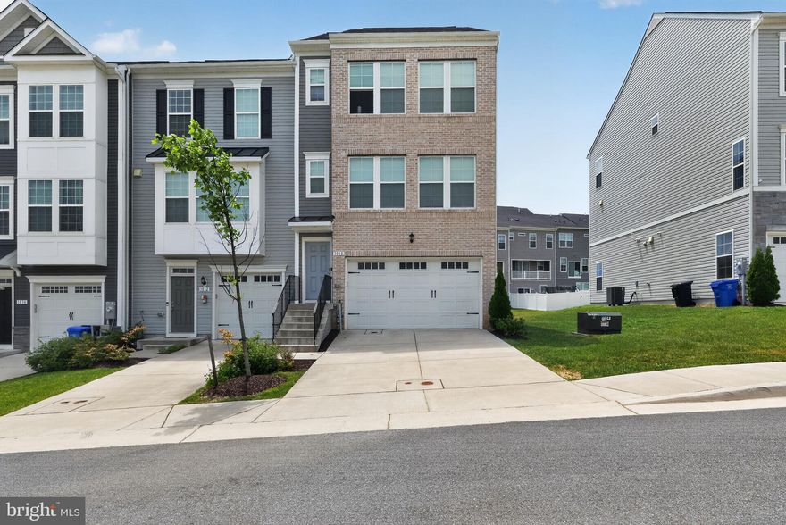 Built in 2022 by Dan Ryan Builders, this end unit townhome in the Laurel Overlook community has approximately 1,840 square feet of thoughtfully designed living space. It features 3 spacious bedrooms, 2 full baths, and 2 half baths.
The open-concept main level is filled with natural light and designed for both everyday living and entertaining, featuring contemporary finishes and a seamless flow between the living, dining, and kitchen areas. The private and intimate deck overlooks open space with no immediate neighbors in sight. The spacious owner’s suite provides a relaxing retreat with a private en-suite bath and walk-in closet, while the additional bedrooms offer flexibility for guests, a home office, or growing needs.
Enjoy the convenience of a two-car garage and a prime commuter location close to major highways, shopping, dining, and everything Laurel has to offer. Perfectly situated between Washington, DC and Baltimore, this move-in-ready home combines comfort, convenience, and modern living in one exceptional package.