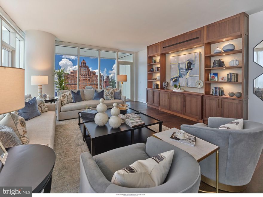 Exceptional Center City living awaits in this stunning 3-bedroom, 3.5-bath high-floor residence at Arthaus, Philadelphia’s premier new luxury condominium on the Avenue of the Arts. Spanning 2,650  square feet, this designer showplace features 10-foot ceilings, wide-plank oak floors, and walls of glass framing breathtaking views to the south, and west. The sun-splashed Great Room offers generous living and dining areas, and a private west-facing balcony—perfect for sunset entertaining. The custom Poggenpohl kitchen impresses with Polar White/Walnut cabinetry, Golden Gate quartz countertops, and Wolf, Sub-Zero, and Asko appliances. The primary suite occupies its own wing,  two walk-in closets and a spa-quality bathroom featuring a freestanding soaking tub, frameless glass shower, separate water closet, and floor-to-ceiling marble finishes. Two additional bedroom suites each include luxurious baths and ample wardrobe space. A powder room, full laundry room.  At Arthaus, enjoy over 36,000 square feet of resort-style amenities, including a 75-foot indoor pool and hot tub, fitness center, steam and sauna rooms, club lounge, conference space, library, rooftop greenhouse, outdoor dining terraces, grilling stations, dog run, and pet spa. Services include 24-hour concierge, valet and chauffeur service, and on-site management for true maintenance-free living. Located in the heart of Center City’s Avenue of the Arts, Arthaus offers easy access to Philadelphia’s finest dining, shopping, and cultural destinations, plus convenient transportation. Luxury, location, and lifestyle — Residence 2203 is turkey ready. Tax abatement is available. One parking license comes with your unit.