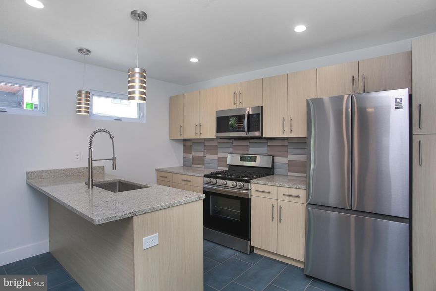 Borough living at it's finest! Recently renovated first floor apartment, walking distance to the center of town. No expense was spared on this renovation, between the quality of craftsmanship and material selections including bamboo & tile flooring, custom designed kitchen cabinets, island with sink & breakfast bar, gorgeous light fixtures, in unit washer/dryer(!), central air, stainless steel fridge and recessed lighting. From the 5 burner Samsung range/oven to the granite counter tops in the kitchen & bath to the Bosch dishwasher. This is a home that anyone could be comfortable in. Large rooms, great flow and lots of natural light abound.  Hardieplank siding, dimensional shingle roof, new windows and doors round out this stately and elegant abode. Gas heat, hot water, cooking and dryer. Walk to the center of town or the many attractions that Doylestown Borough has to offer in minutes. Welcome home!