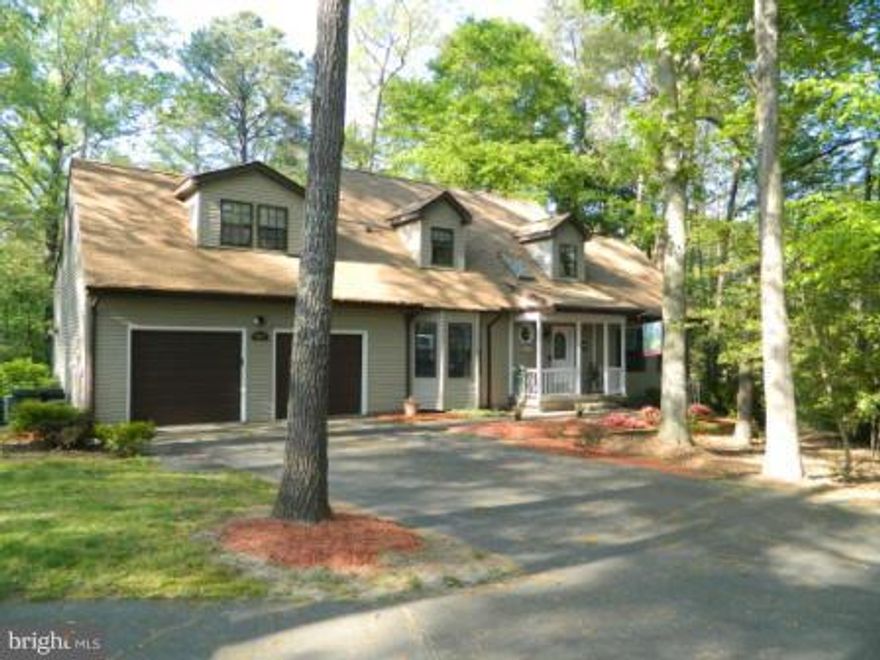 Wonderful Cape Cod lovingly maintained, at the end of the street. Property is .44 acres of privacy. 4 bedrooms with master on main, 2.5 baths. upstairs has in law-au pair area with separate fridge and kitchenette, plus private entrance from garage. Main level features nice family room with fireplace, formal dining and wonderful eat in kitchen. Screen porch and lovely backyard