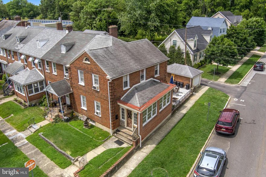 Welcome to 655 Saude Avenue, a spacious five-bedroom, two-bath brick end-of-row home in Essington’s Westinghouse Village neighborhood.
Enter through the bright and inviting sunporch, a charming spot filled with natural light and the perfect place to start or end the day. From there, step inside the main level. To the left are two generously sized bedrooms, currently set up as sleeping quarters but easily converted back into a traditional first-floor living room if that better suits your style. To the right is a large eat-in kitchen featuring granite countertops, a stacked stone breakfast bar with pendant lighting, original hardwood floors, and plenty of space for a full-sized table—ideal for everything from quick breakfasts to long conversations over dinner.
Just beyond the kitchen is a spacious mudroom with access to the private rear patio and detached garage. The backyard offers a peaceful backdrop, overlooking the woods and providing a welcome bit of privacy.
The fully finished basement adds even more living space, with a large den, laundry area, a full bar, and an additional full bath—perfect for relaxing, entertaining, or hosting friends.
The property is currently operating as an airline workers’ crash pad, offering a unique opportunity for someone interested in continuing a ready-made, turnkey business. Of course, it could just as easily be transformed into a wonderful place to call home.
With its flexible layout, generous space, and unique possibilities, this Essington property is ready for its next chapter.