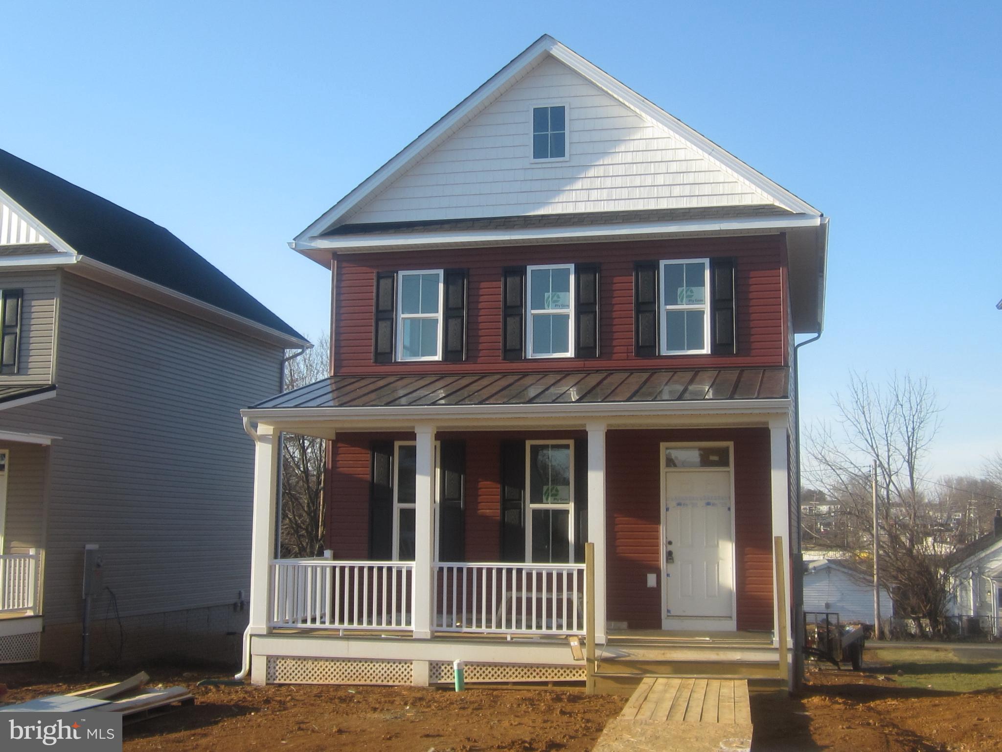 New construction by a small builder that gives attention to the details. Open floor plan on the main level that includes a half bath. Kitchen has stainless appliances and a pantry for plenty of storage. Off the dining area is a door leading to a deck that's perfect for entertaining and grilling. Second level has three bedrooms and two baths one of which is in the primary bedroom. Walk out basement for additional space with a rough in already in place for an additional bath. Large windows for tons of natural light and a large front porch just waiting on the rocking chairs. Off street parking will be provided behind the house with additional parking in the front.