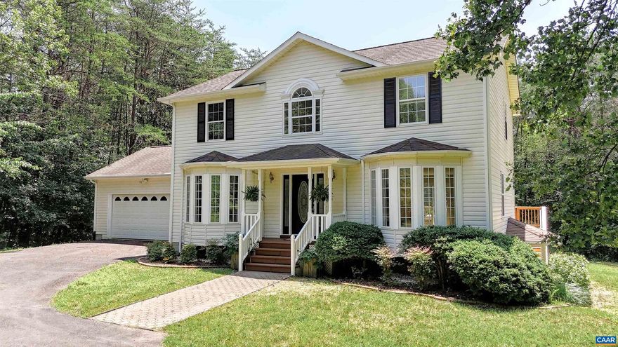 This home has been completely renovated and upgraded! This home features new kitchen cabinets, solid surface counter tops (all high end), new laminated wood flooring through out the house (except for new tile in the bathrooms), all new fixtures, paint, all updated with a modern look. This property comes with lake access to Bowler Mill Lake, one of the hidden treasures of Louisa County. The fully finished basement offers more space for fun and recreation! The big back deck offers great privacy and a connection to this beautiful wooded 3 acres lot. In addition, this home has a 2 car garage and a Quonset Hut that provides outdoor storage or shop area. Come tour this beautifully renovated home today!,Solid Surface Counter,Wood Cabinets