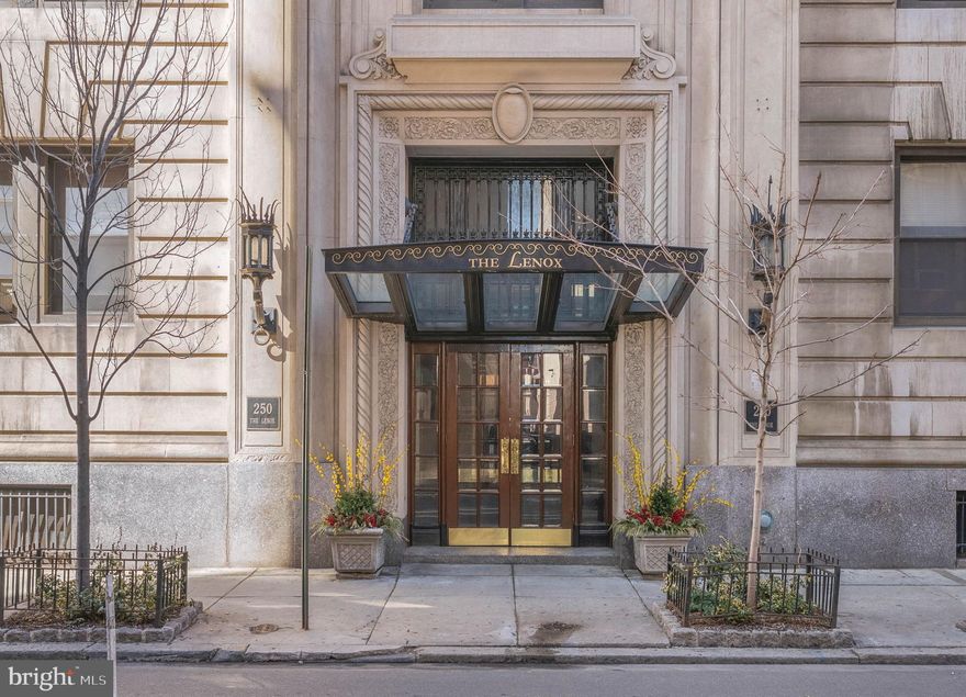A prized parking spot and a prime location make 250 S 13th St #12E a standout choice for a
buyer seeking the best of city living. Located in The Lenox, a historic and meticulously
maintained property just off Broad Street in Washington Square West, this 1 bed, 1 bath corner
unit boasts a luxuriously renovated kitchen, mini-split A/C, and mesmerizing skyline views in
addition to the building’s welcome desk, prompt elevator service, laundry room, and relaxing
roof deck. Stepping through the grand double doors, you’re greeted by an elegant lobby
swathed in rich wood, gleaming marble, and ornate millwork. Inside the unit, a spacious foyer
offers two organized closets and room for a bench. Intricate hardwood floors stretch into the
bright, airy living room and open kitchen. Soaring ceilings frame the space, while bay windows
provide lots of natural light and a carved fireplace mantel acts as an anchor. The layout easily
accommodates separate areas for relaxing and dining. The show-stopping all-white kitchen is
fitted with generous custom shaker cabinetry, quartz waterfall counters that rise into the
backsplash, and a mix of high-end stainless steel and hidden panel appliances. On the
opposite wing of the home are the updated full bathroom and the large bedroom, complete
with tall windows and a walk-in closet.  In addition to everything inside, The Lenox sits at the
intersection of Washington Sq W, Center City, and Rittenhouse, earning a near-perfect Walk
Score of 98 and is dog and cat friendly! Lively entertainment at The Kimmel Center, the city’s best shopping along WalnutSt, and award-wining dining on 13th St are all steps away. Sprawling parks are close, plus there’s easy access to Pennsylvania & Jefferson Hospitals, City Hall, public transit, the
Parkway, and I-676. Schedule your tour today! Some photos are AI enhanced.