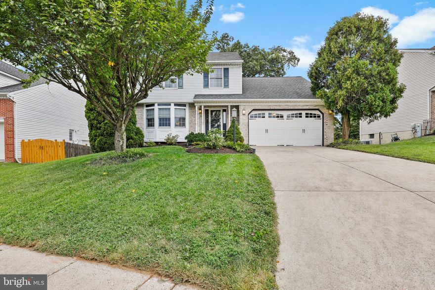 Gorgeous 3 bedroom, 2.5 bath home with two car garage located on a quiet cul-de-sac in Overview Manor! Hardwood floors in foyer, living room and dining room. Eat-in white kitchen with stainless steel appliances and Silestone counters. Sunken family room with cathedral ceiling, wood burning fireplace (with insert) and patio door to deck. Spacious primary bedroom with cathedral ceiling and en-suite bath with double vanity and tub. Two additional good sized bedrooms and hall bath on upper level. Fully finished walk out basement with built-in bar and raised hearth with pellet stove. This is a large space great for entertaining! Laundry/storage room in lower level. Deck off of the family room with covered gazebo overlooks the backyard with mature trees for privacy. Additional patio area off the lower level. Shed in the rear yard for additional storage. This home is beautiful! Patterson Mill School District!