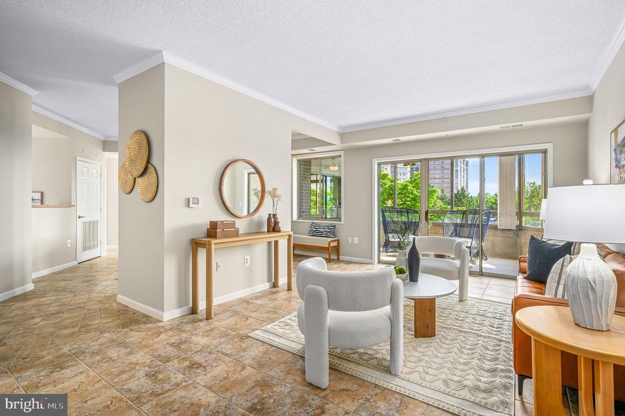 BACK on the market refreshed and with a PRICE ADJUSTMENT and NEW LOOK! Gorgeous updates!! Offering 1,446 square feet of well-designed living space, PLUS a spacious glass enclosed balcony, this unit provides easy access to the front and back of the community providing easy convenience to the back entrance, walking trails, and gardens. As you step inside this unit, you will immediately notice the beautiful ceramic tile flowing throughout the kitchen, living and dining area. The eat-in kitchen features newly updated appliances, perfect for whipping up your favorite meals and a laundry room with plenty of space for storage and shelving. The open layout flows seamlessly into the living/dining area, which leads to a spacious balcony—ideal for morning coffee or evening relaxation. The dining area has an extra closet to store all your dishes/linens. A 2nd bedroom is located next to a hall bathroom and also opens to the sunroom providing extra space for your guest or your home office. The owner's suite provides great natural light along with two closets and ensuite bath. The amenities in Lansdowne Woods 55+ community are second to none! Stay active with access to a gorgeous clubhouse complete with gym, indoor pool, and tennis court, or unwind in the spa and game room. Love racquetball or billiards? We've got you covered with dedicated spaces for both. Additional perks include storage unit (storage room 6, bin #139), lots of onsite coordinated activities within the building's community room/patio and three elevators for easy access. This vibrant 55+ condo community offers the perfect blend of modern amenities and serene living. Easy access to Route 7, grocery stores, restaurants and retails stores. Don’t miss the opportunity to make this delightful unit your new home!