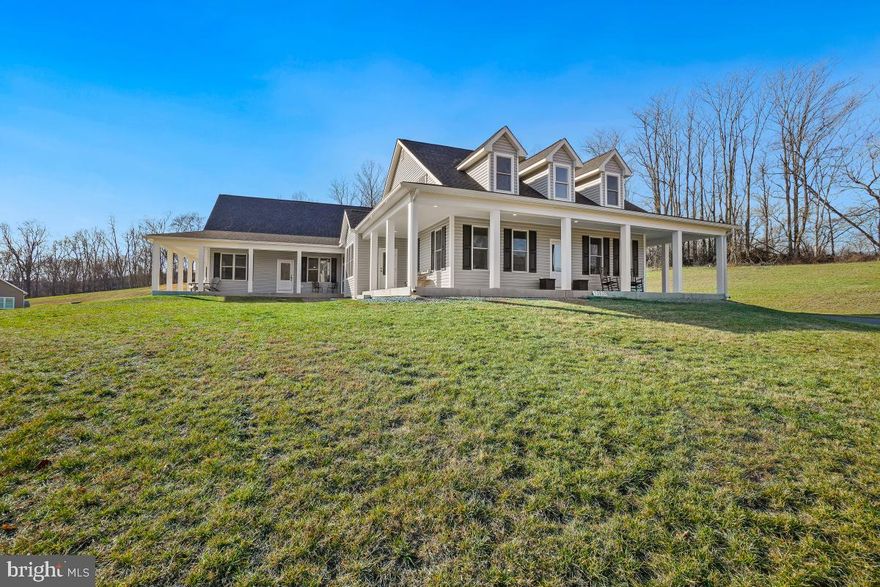 ** $50,000 PRICE REDUCTION**  on this Custom Designed Masterpiece with views for miles on 10 glorious acres! Enjoy the most breathtaking sunrises and sunsets from your wrap around porch or large, bright windows! Spacious main home has 5 bedrooms; 3 on the main level including primary bed and bath and 2nd full bath; plus 2 bedrooms, a full bath, gaming nook and a family room on the upper level. Open floor plan guarantees great sight lines from everywhere in the main areas. Large pantry and laundry room are just off the kitchen. Gorgeous chef's kitchen with Thermadore  LP gas cooktop, double wall ovens and easy access microwave. Enjoy the huge island for prep work, serving, dining with a large crowd or just relaxing with a snack and a glass of wine after a long day.  Lower level awaits your imagination. Builder planned for a wine cellar by including a concrete room in the lower level.
You can have multi-generational living with the amazing, attached 1300 sq ft Guest House/In-Law Suite. It can be accessed from the main house or through front and rear private exterior entrances.  The suite features its own elegant kitchen, dining area, and large living area. Two bedrooms and 2 full baths, a laundry closet and large wrap around porch complete the space. Host your guests, in-laws, grown family members or even a B&B!
Custom designed and built by one of the best custom builders in the area, Barbera Contractors LLC, as his personal home. You'll love the expert craftsmanship, high end finishes, and attention to detail.  If you have any questions please contact helpful Listing Agent!