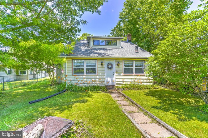 Located just one block from the shores of the Chesapeake Bay, this delightful vintage Cape Cod offers seasonal water views and timeless charm. The home features a main-level bedroom and full bath, along with a cozy enclosed front porch that adds extra living space — perfect for relaxing or entertaining.
Upstairs, you’ll find two additional bedrooms (note: no closets) and a second full bath. The fully fenced yard provides privacy and plenty of space for gardening, pets, or outdoor enjoyment. A detached garage/shed offers valuable additional storage. Recent updates include a new roof (2023), and the home is only a block from the community pier — ideal for those who love boating or fishing. Nestled in the heart of Deale, this home offers easy access to award-winning marinas, waterfront dining, and unique local shops. Come experience the charm and lifestyle of living on the Chesapeake Bay!