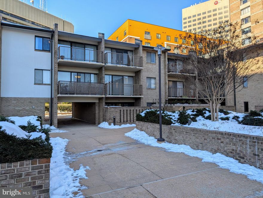 PRICE IMPROVEMENT – MOTIVATED SELLERS!
Discover 821 square feet of bright and airy living space in this spacious impeccably-maintained one-bedroom, one-bath condo, ideally located in downtown Rockville. This home boasts gleaming hardwood floors throughout, a private east-facing balcony, and a rare in-unit washer and dryer for added convenience. Dedicated garage parking makes city living stress-free.
ABUNDANT NATURAL LIGHT & BEAUTIFUL VIEWS
Enjoy gorgeous morning sunlight streaming through the large sliding glass doors that open to your private balcony. From here, admire the peaceful courtyard and the American flag at Veterans Park, just outside the community. On the west side of the condo, you’ll find a serene view of Monroe Park, a beautifully maintained city park with lush landscaping year-round. Open the west-facing window for a refreshing cross breeze that fills your home with fresh air.
WALK TO METRO – PERFECT FOR COMMUTERS!
Live in an ultra-convenient, walkable neighborhood! The Rockville Metro Station and Marc Train Systems are just 0.2 miles away, giving you an effortless commute. With quick access to I-270, shopping, dining, and entertainment, everything you need is just steps from your door.
PRISTINE CONDITION - MOVE-IN READY!
This home has been lovingly cared for and meticulously maintained, offering a clean, well-kept space that’s ready for its next owner.
ALL-INCLUSIVE AMENITIES & 24/7 CONCIERGE SERVICE
Your monthly condo fee covers all utilities—electricity, water, gas, trash and snow removal, daily cleaning of common areas, and professional landscaping. This well-maintained, gated community offers top-tier amenities, including:
- A 24-hour concierge who receives all packages
- A refreshing outdoor pool
- An updated gym
- A reservable community room for private events
- A sauna for relaxation
- A small private storage room
- Beautifully maintained grounds
COZY KITCHEN WITH POTENTIAL
The charming, light-filled kitchen features open shelving for easy access and organization, with plenty of potential for modern updates to make it your own.
A rare find with all utilities included—schedule your private tour today!