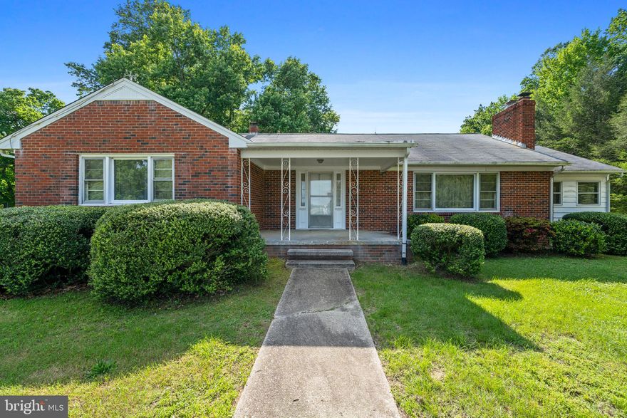 OFFER DEADLINE: Tuesday (6/18) at 8pm.  
Looking for a comfortable home or a quality investment away from the hustle and bustle of the big city? Enviably located south of Washington DC in a peaceful Charlotte Hall neighborhood, this delightful brick ranch-style dwelling might just be what you’re searching for! Set well back from the street on a sprawling 5.32-acre lot, a horseshoe driveway bordered by lush foliage and towering trees leads to this 1958-built abode’s covered porch. Brand new HVAC put in 2024. Step inside the sunlit layout that presents endless potential for your creative imagination, currently finished in commercial-grade carpeting, soft pastel tones, and textured ceilings. Large windows fill the living room with abundant natural light, illuminating the inviting brick fireplace that lends warmth on cooler nights.

A well-sized dining room centered around a scenic window paints a picture of intimate and memorable celebrations spent under its elegant chandelier. Breathe new life into the cheerful kitchen that comes with a complement of appliances, tons of cabinetry, an oversized pantry, sleek countertops, and linoleum floors. Venture downstairs to discover the generous versatile basement, divided into two sections to suit your lifestyle. A wood stove and bar area cater to joyous gatherings on one side, while the other can be used as a recreational area, studio, or crafts corner, complete with power tool outlets and a laundry room.

After a long day, escape to the restful proportions of the comfortable retreats offering ample storage for your individual needs. A refreshing hall bath with a shower/tub combo accommodates the secondary bedrooms, one of which can be utilized as a private office for remote work set-up. The larger primary suite features a walk-in wardrobe, two smaller closets, and a convenient ensuite with a step-in shower. No matter the weather, the screened-in patio, with its paneled walls and crank-out windows, offers a haven for relaxation. Additional inclusions are a built-in cabinet with fold-out doors to keep coats and linens organized, oil-fueled heating, a central air conditioning system, an oversized shed, and a smaller workshed with a working power outlet.

Outside, create a personal oasis where you can host weekend get-togethers in seclusion. Cultivate a farm-to-table garden, build income-generating ADUs, or add a deck where you can unwind in tranquility. Centrally located, an array of Charlotte Halls’ shopping and dining options are within reach, including McDonald’s, 7/11, Tequila Grill & Cantina, Pizza Hotline, Arby’s, Charlotte Hall Shopping Center and Farmer’s Market, and Outdoor Supply Company. Plus, the United States Postal Service and the highway are easily accessible. Come for a tour while it’s still available!