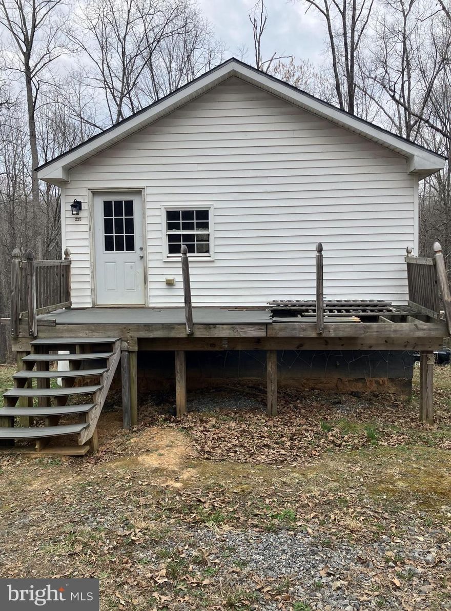 Handy man/investor special in a lovely forest with quiet neighbors. The house has good bones and great potential.  Your imagination is the limit of what can be done with the property and the almost three wooded acres, three miles from Louisa.