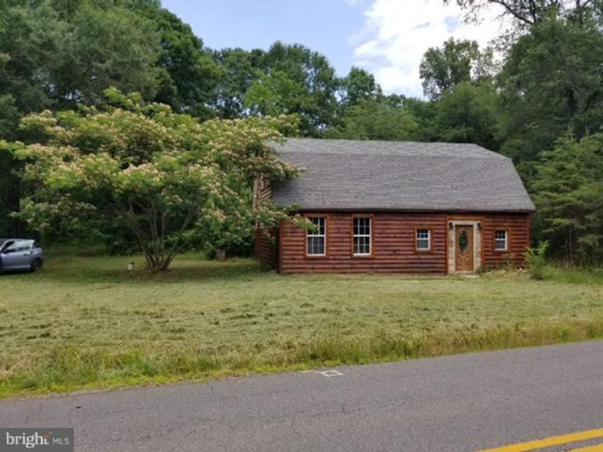 Log sided home on 1.5 acres with huge storage building sold as is.  Seller has worked on house some but selling as is.  Storage building could be anything you need.