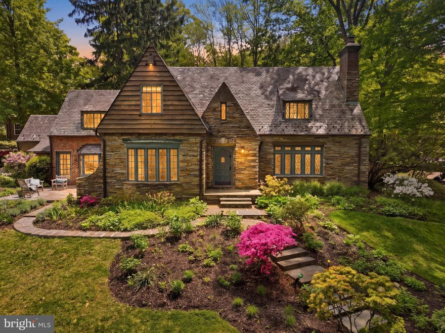 Showings by appt only. 

Completely renovated and expanded whimsical Tudor-Revival home in historic Greenwich Forest.

Nestled within the enchanting Greenwich Forest neighborhood and within walking distance to downtown Bethesda, this captivating Tudor Revival residence offers an ideal blend of authentic architectural character enhanced with every modern amenity.

The steeply pitched gables, slate roof, and diamond-paned windows are hallmarks of the Tudor aesthetic, while the irregular stone masonry and clipped roof dormer add to the home’s whimsical cottage appeal. Absolutely stunning, the 5 bedroom, 4.5-bath home offers a renovated, state-of-the-art kitchen and baths, within a framework appointed with exposed wood beams, random-width hardwood flooring, and dramatic ceiling lines.

At every turn, surprises await: from custom built-in furnishings to the curved iron stair railing. Designed with a circular flow, the floor plan offers a handsome formal living room with a fireplace, an inviting enclosed porch, a charming breakfast room, and a state-of-the-art kitchen and family room that is drenched in sunlight. The kitchen features a walk-in pantry, a substantial island and a commercial chef’s range. With three walls of exposure, a beautiful fireplace and transomed glass doors, the family room opens to an expansive patio surrounded by lush gardens and stacked stone walls. An entertainer’s dream, the backyard is perfect for outdoor gatherings, complete with space for a firepit, a cooking area and ample seating.. The main level also features a mudroom, an exercise/fitness area, a powder room, and a fabulous custom home office with an adjacent wet bar.

Ascend the stairs to four bedrooms and three full baths. The primary suite features a fireplace, multiple windows, a deep walk-in closet and a Juliet balcony overlooking lovely views. The primary ensuite bath is finished with dramatic marble, a dual vanity, skylights and a “wet room” style shower with an integrated freestanding soaking tub. The design elements in the private spaces include floor-to-ceiling shelving, a renovated hall bath, an expansive bedroom with an ensuite bath, and another bedroom with an arched entry and vaulted ceiling.

Finished with luxury vinyl plank flooring, the lower level features a flex room with another fireplace, perfect for recreation, billiards, a playroom or another home office. Designed for guests, in-laws or an au pair, there is another bedroom, a full bath, and a kitchenette on the lower level.

Renowned for its tree canopies and gardens, Greenwich Forest is close to all that downtown Bethesda offers, yet retains a captivating English countryside vibe. In perfect harmony with its glorious natural surroundings, this is a home of timeless architectural distinction, with its original character intact and every modern luxury masterfully incorporated.