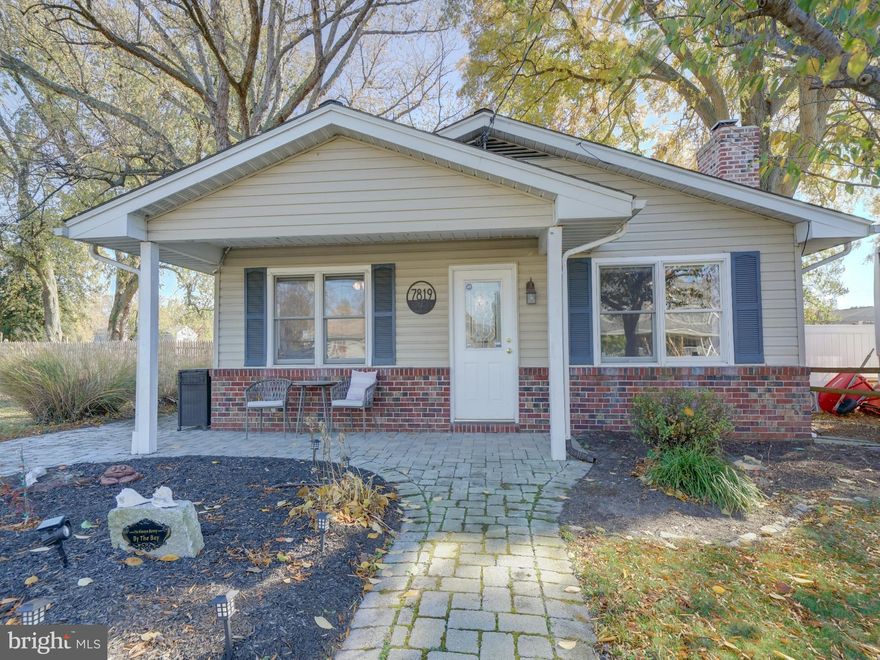 This charming 3 bedroom, cottage style home, offers a unique opportunity to enjoy water-oriented living within a vibrant community of Bayside Beach in Pasadena. Nestled on a flat lot, this home has room to park your boat or other vehicles in your own concrete driveway. The property is strategically located near local parks and recreational areas, providing residents with ample opportunities for outdoor activities including a community beach, boat ramp access, pavilion and playgrounds. The nearby water access to the Patapsco River allows for various water-related pursuits, fostering a lifestyle that embraces nature and leisure.  Enjoy your outdoor amenities with a covered porch in the front, a paver patio in the rear, walkways and a fenced backyard.  Separate shed in the rear yard. The interior boasts a living room with cozy fireplace, a built in bookcase and desk, enhancing the inviting atmosphere of the home as you enter. The kitchen has been updated and includes quartz countertops, backsplash and modern SS appliances. The table space in the breakfast nook looks out to the front porch and there is a side door for easy access to the driveway. For added convenience the first floor laundry room is spacious, with extra cabinets, utility sink, along with easy access to the water treatment system and utilities. The hall bath has a double vanity and tiled tub/shower combo. The back of the home has the 3 bedrooms all with closets and natural light. There are wood floors, ceiling fans and recent improvements including: roof (2021), hwh (2021), well pressure tank and softener (2021). This property represents a harmonious blend of comfort, community, and convenience, making it an ideal choice. Call your agent today!