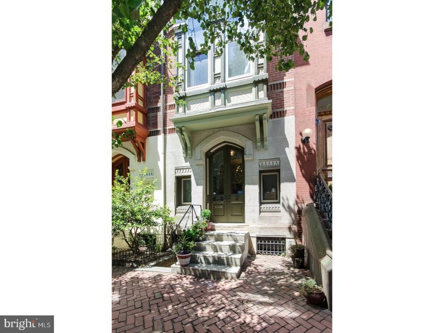 Beautiful Rittenhouse Square Victorian attributed to Frank Furness with wood floors throughout. Pretty double doors with wide foyer before entering sitting area open to galley kitchen with stainless steel appliances, tile backsplash and wood cabinets. Spacious dining room with high ceilings, decorative mantle, wall sconces, built-in display shelves/cabinets and French Doors to pleasant outdoor deck. Second floor rear library with oak bookshelves and desk custom designed and installed by the Sellers and library ladder for the 12 foot ceilings. This level includes a powder room and wet bar. Sunny front living room with South facing windows, very high ceilings and decorative mantel. Bright third floor, master bedroom with glorious wood floors, bath with double sink vanity and tiled stall shower. Rear bedroom with bay windows and beautiful mantel. Fourth floor has 2 bedrooms also with high ceilings, bath off of the hall and sauna! Lower Level now used as a home gym with full bath and separate entrance. Two leased parking spots to be assumed by incoming residents at the indoor garage on Samson Street behind the Rite Aid, one block away. This is an architecturally significant home on a special Rittenhouse / Fitler Square street, walkable to Drexel University, University of Pennsylvania, The Hospital of the University of Pennsylvania, CHOP, The Cira Center, The FMC Tower and 30th Street Station for an easy NYC City or Princeton Commute. Newer gas, radiator heating. Updated two-zoned central cir conditioning with lower level and first floor as one zone and the upper levels a second zone.