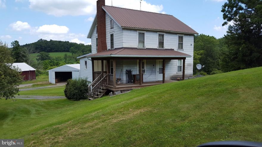 Quiet and private home,renovated first floor,new windows on first floor,new roof,attached garage, enjoy the peace of the wrap around porch,entrance through a right away lane,agent is related to seller. Age of property is aprox.