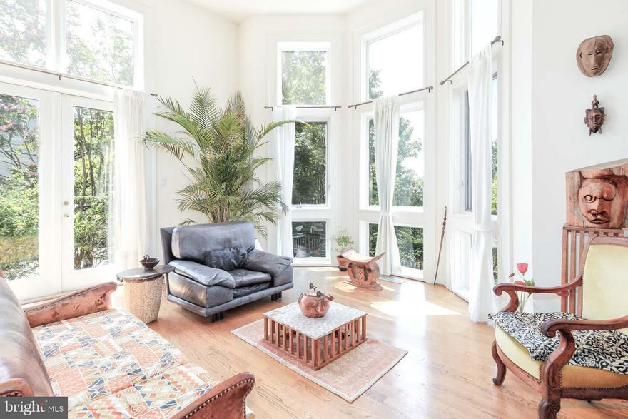 Location location location!   Blocks to Bethesda Row on a corner lot nestled in the beloved Edgemoor / Bradley Village community!    This unique, architect-built contemporary home boasts 4 bedroom suites each with their own attached baths, large closets and floor-to-ceiling windows.   A sun lover’s dream as you enter the double-story foyer, you’re greeted with the light from the soaring  20ft+ ceilings of the “sunken” large room with modern concrete fireplace, built-in bookcases and a dining room perch overlooking it all!   The 16x18 kitchen and library-style office complete the main level with 5th full bath perfect for guests.   A second level primary suite boasts double walk-in closets, large soaking tub and separate shower.  Plus, the wide and sunny hall has a laundry room with ample storage.  Ascend to the 3rd level with full kitchenette, wonderful for grown kids or live-in support.  A rare side-entry driveway has 2-car garage that leads to the lower level rec space perfect for gym, office or play.   All this minutes to Metro, Bethesda Row shops and restaurants, Capital Crescent Trail and all the Bethesda “favorites” we love!   Call Mary Noone for more information.