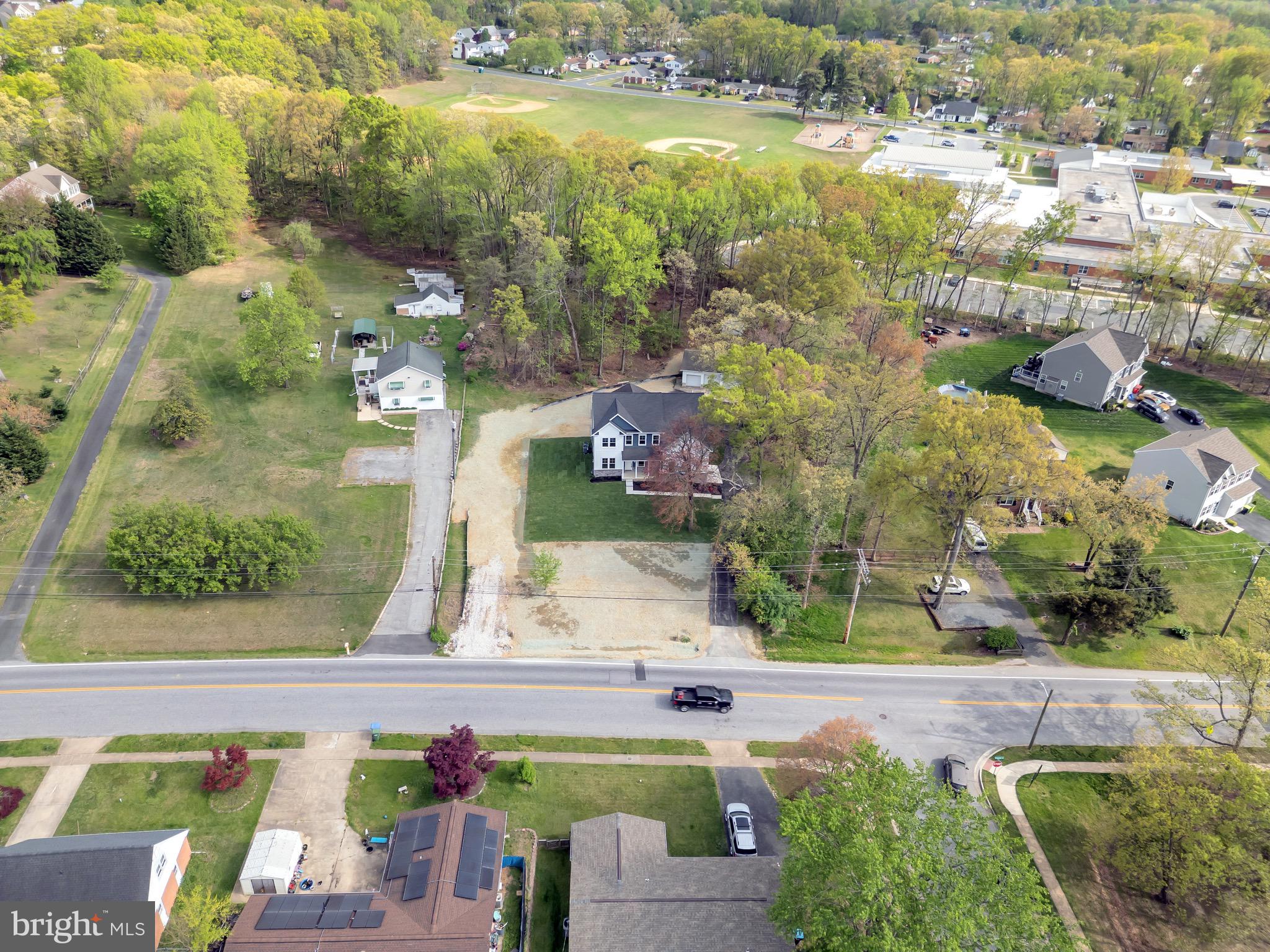 To be built luxury coastal colonial on large flag lot backing to trees/ school