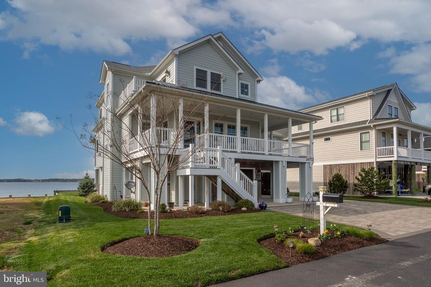 Nestled in a serene waterfront setting, this unique property offers a rare blend of tranquility and convenience. Constructed prior to the development of Seagrass Plantation, it boasts deeded access through the community, while enjoying the benefit of no HOA fees and remarkably low taxes.  The home's design prioritizes comfortable first-floor living and breathtaking water views from every vantage point.  Spanning approximately 2,962 square feet, the residence features a master suite on the main level, along with spacious living and dining areas, an office, and a powder room.  Upstairs, three bedrooms, a loft, and two baths all open onto expansive decks showcasing panoramic vistas of the Indian River Bay and surrounding marshlands.  Quality construction is evident throughout, with 2x6 framing, hurricane-rated Anderson windows, Hardie plank siding, and Azak trim.  A 75-foot pier with a boat lift extends into the bay, perfect for boating enthusiasts.  The property also includes public water and sewer, an irrigation well, and efficient electric heating and cooling.  Enjoy stunning sunsets over the water, abundant wildlife, and the peaceful ambiance of this exceptional waterfront retreat. For pre-approved and verifiable cash buyers, a pre-listing inspection from Gold Standard is available for review. It's important to note that the seller's flood policy is transferable, with an annual cost of approximately $700. This addition provides valuable information for potential buyers regarding the property's flood insurance coverage and associated costs. Seagrass Court in Dagsboro, DE is separate from the Seagrass Plantation community. While access requires driving through Seagrass Plantation, the waterfront properties on Seagrass Court do not fall under the community's jurisdiction and are not subject to HOA regulations.