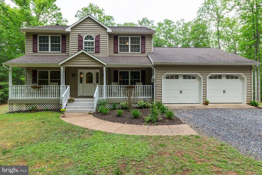 Extremely well maintained two story colonial with fully finished basement.  The basement offers an outside side entrance, a full kitchen and bathroom.  This beautiful home has a private setting on 12 wooded acres.  The main level offers an eat in kitchen, family room with wood burning fire place and separate dining room for family gatherings.  Hardwood floors through out the main and upper levels.